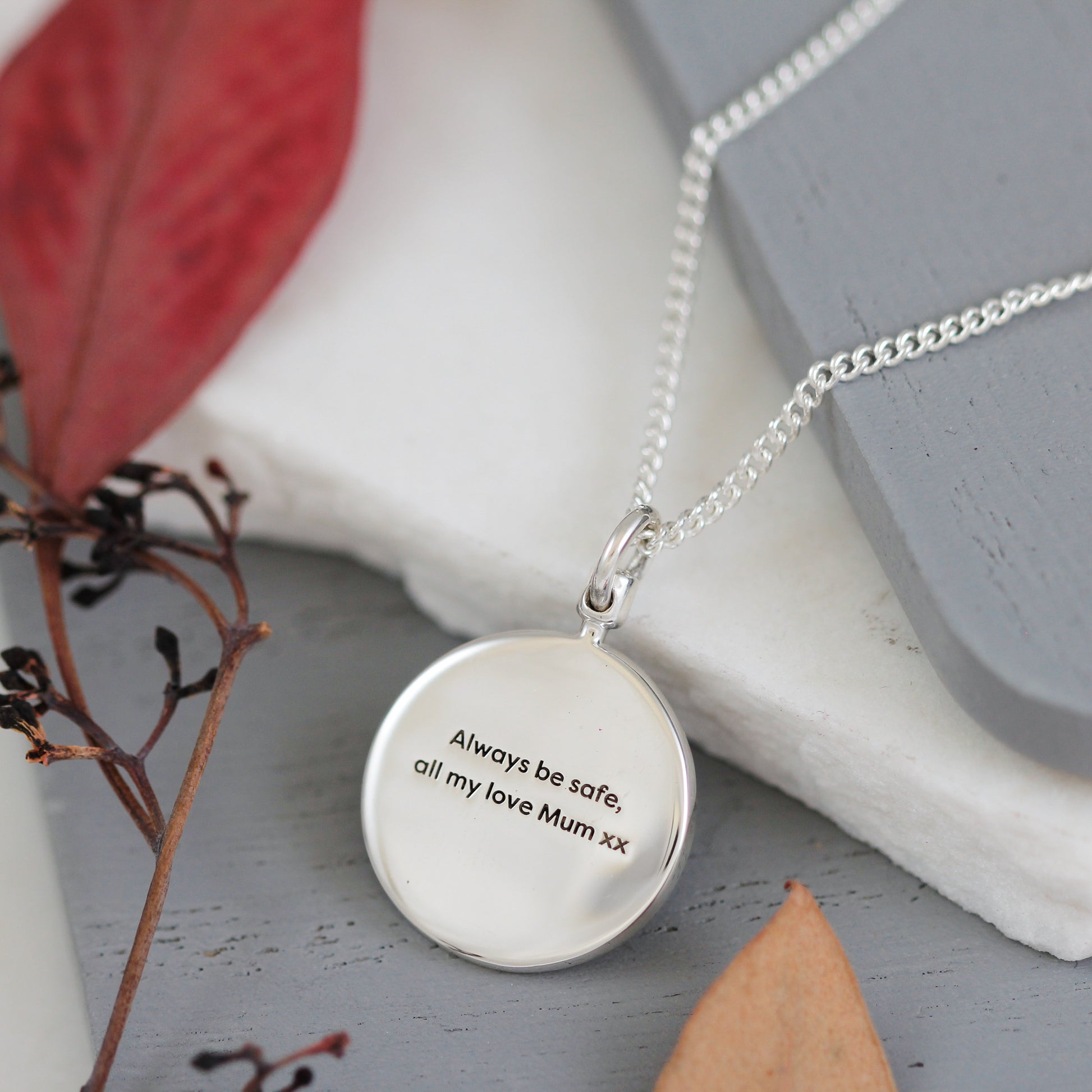 always be safe engraved back of globe pendant
