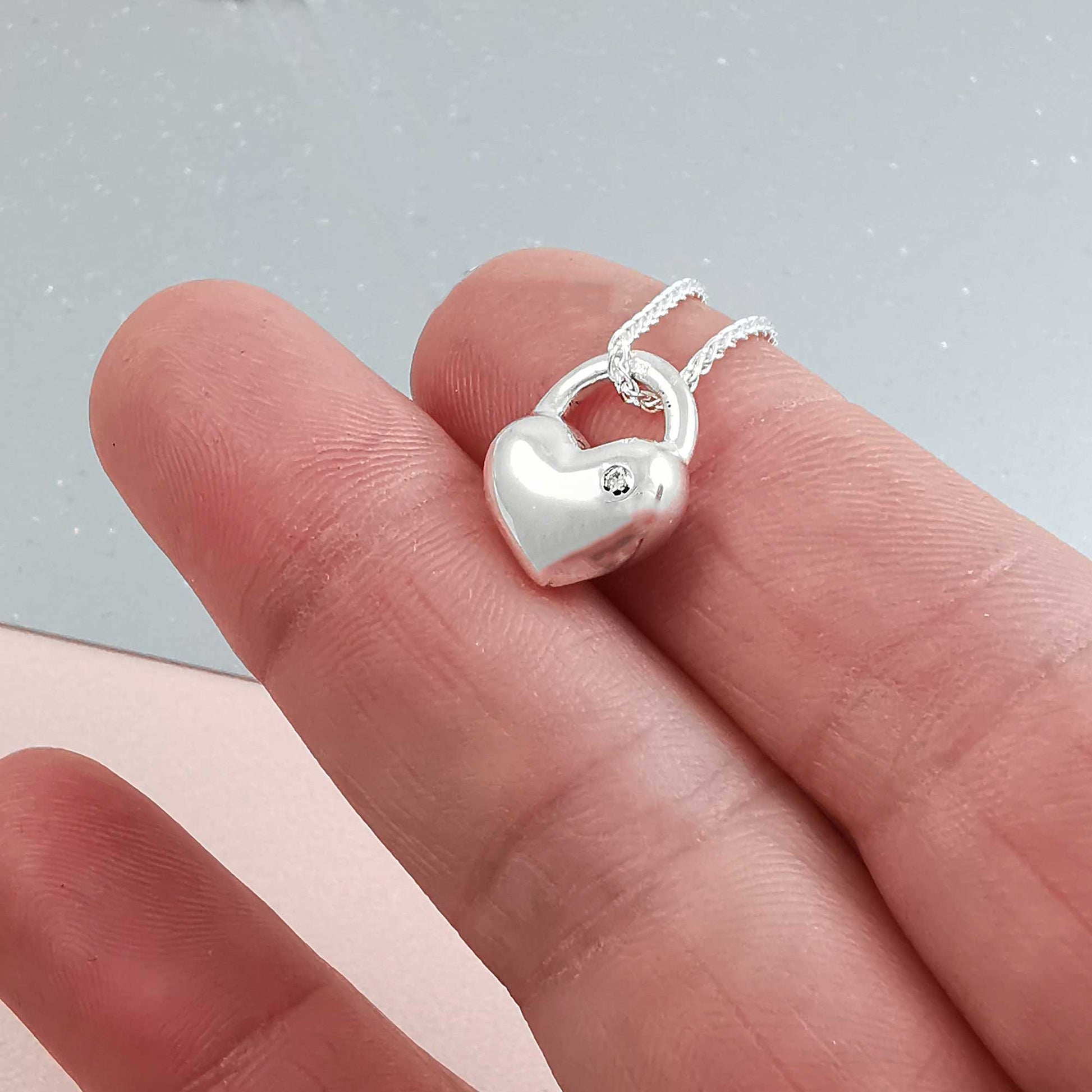 diamond set in solid silver rounded heart necklace