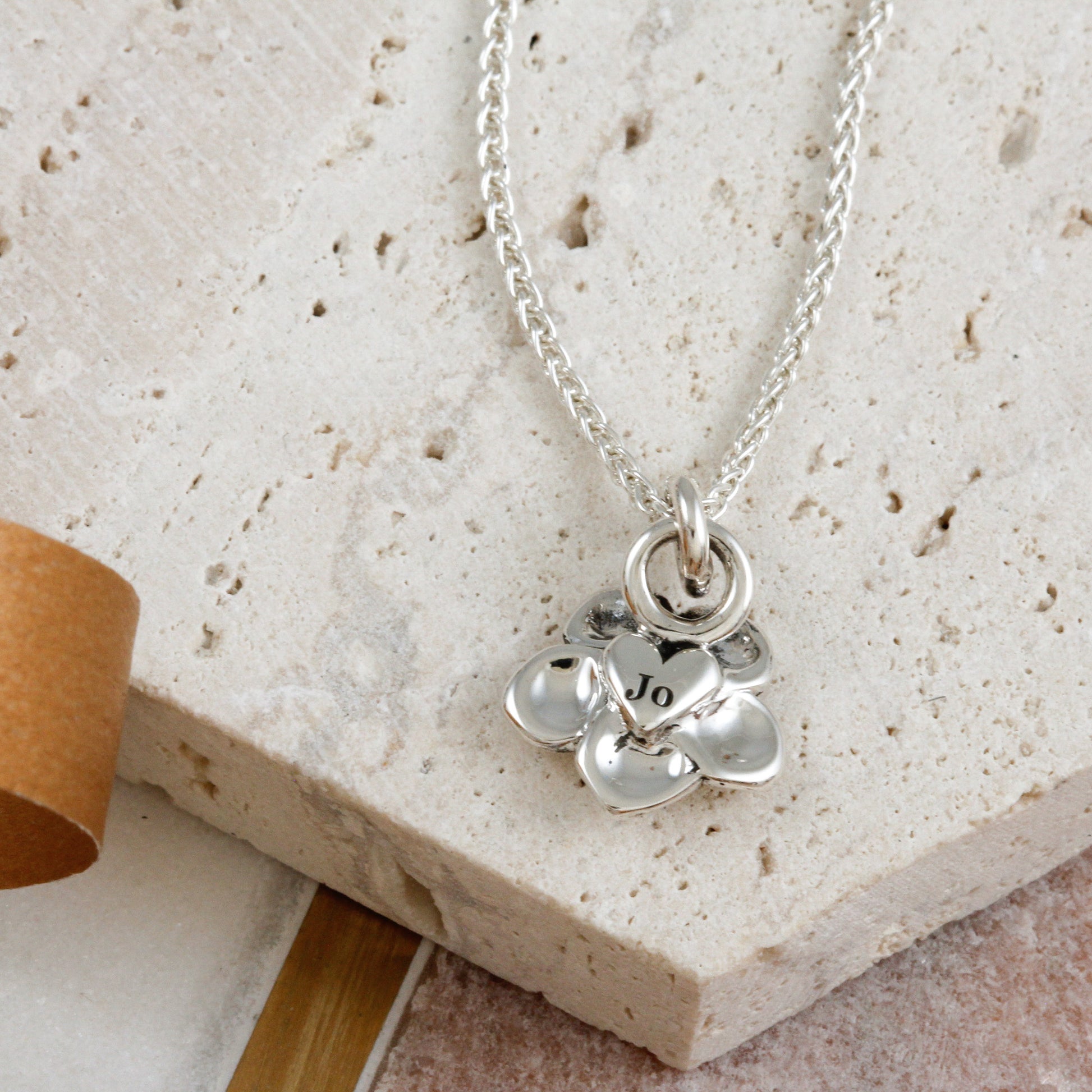 engraved name back of forget me not necklace