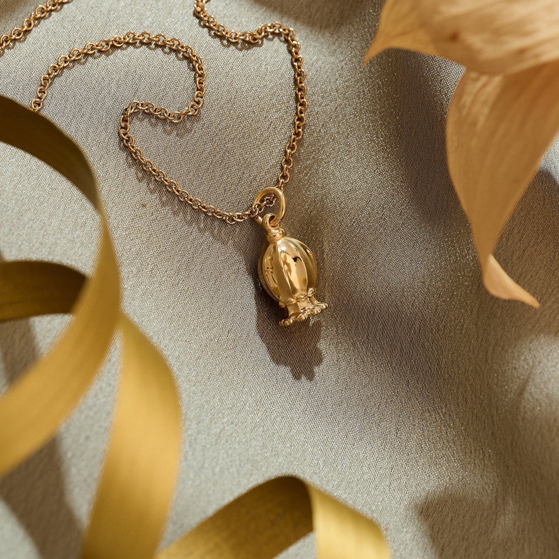 gold plated silver poppy seed pendant nature jewellery