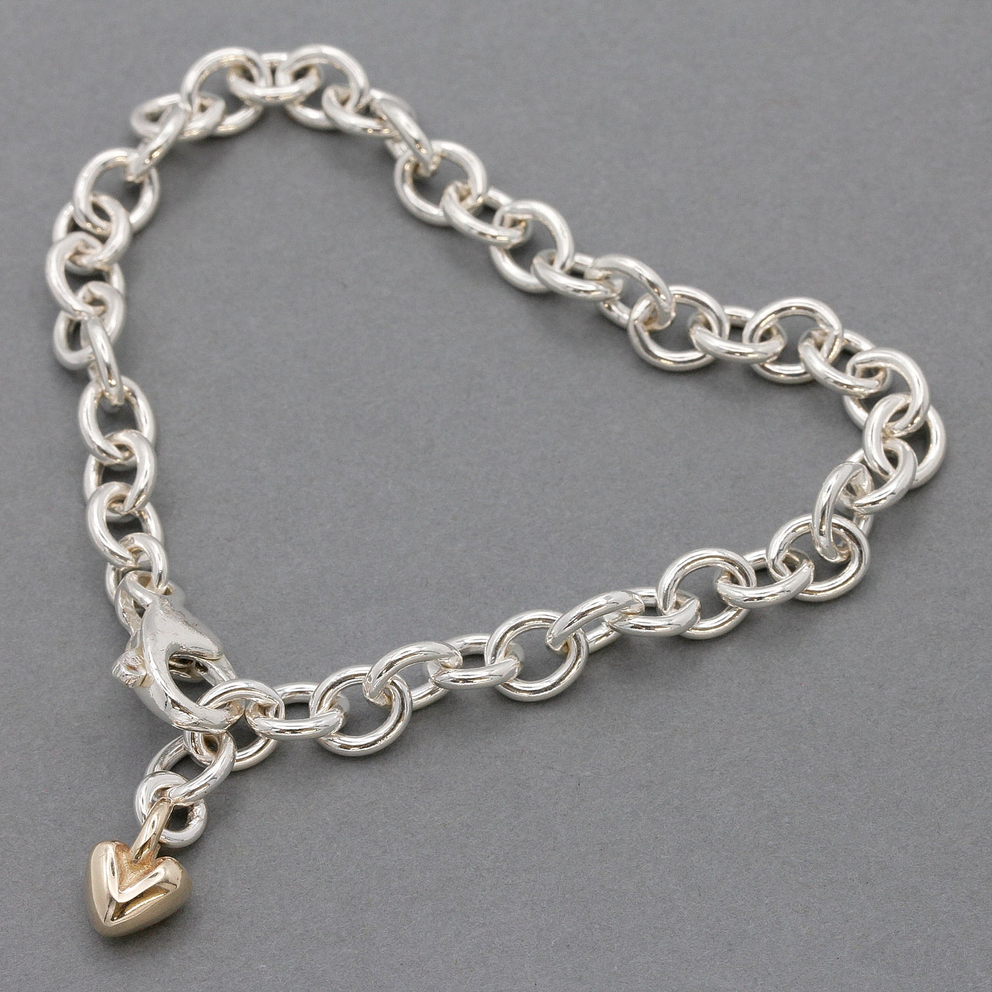 silver adjustable charm bracelet with solid recycled gold heart