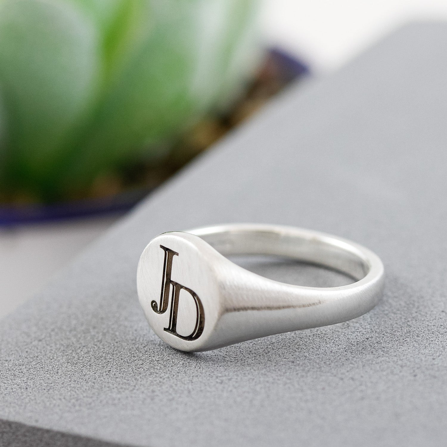 silver initials overlapping signet ring