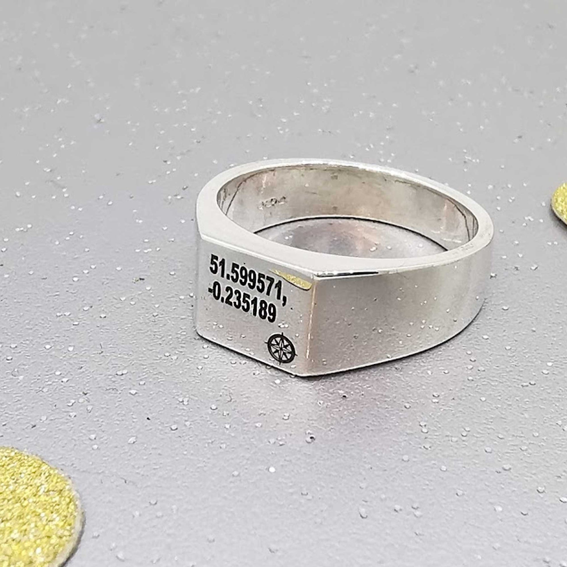 square signet ring engraved with coordinates latitude longitude