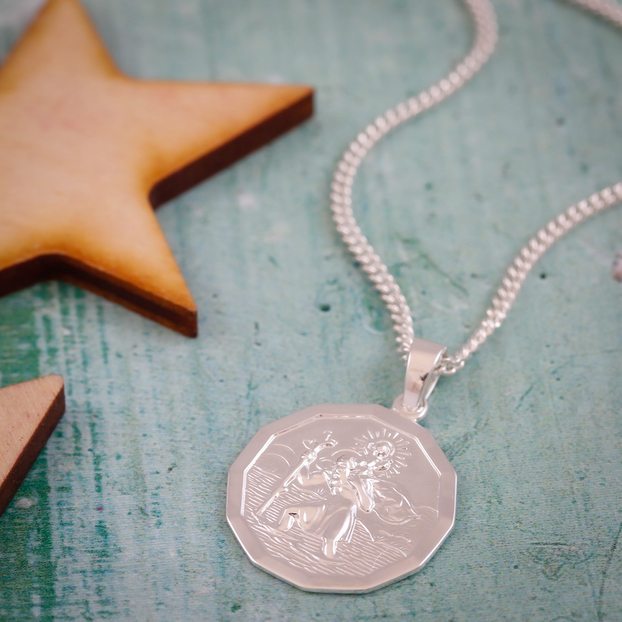 cast silver dodecagon st Christopher necklace on curb chain