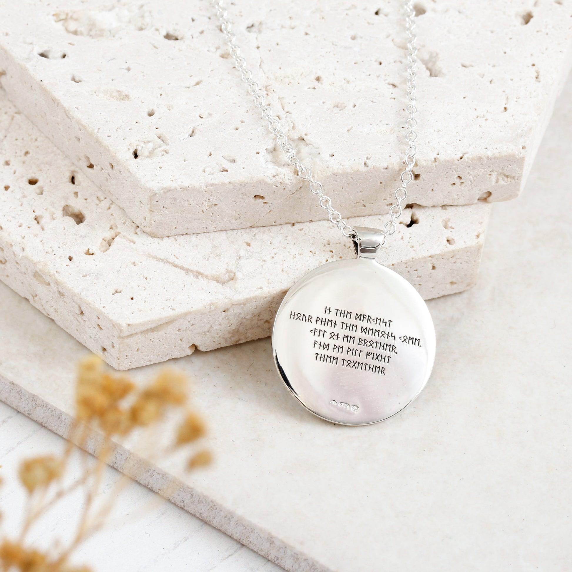 rune necklace engraved in runic message on the back