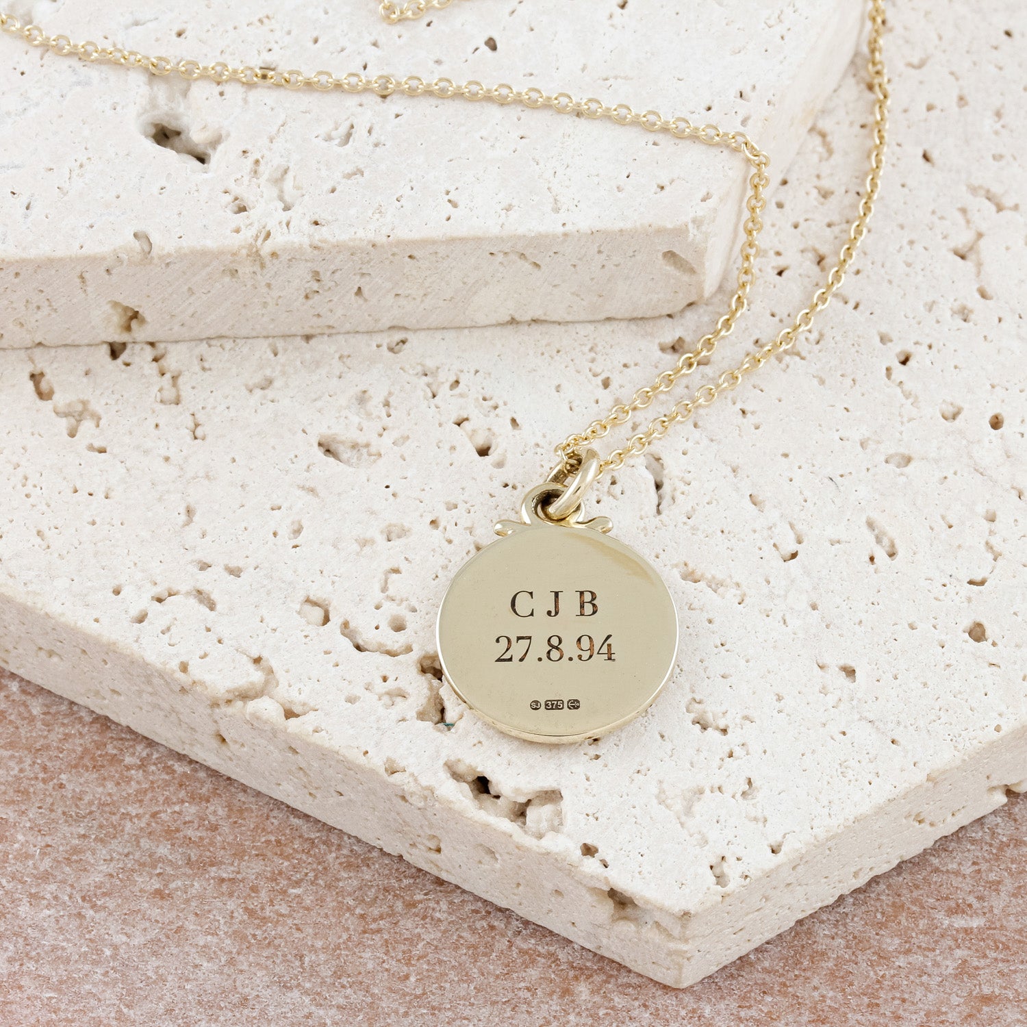 engraved back of solid gold saint christopher on trace chain