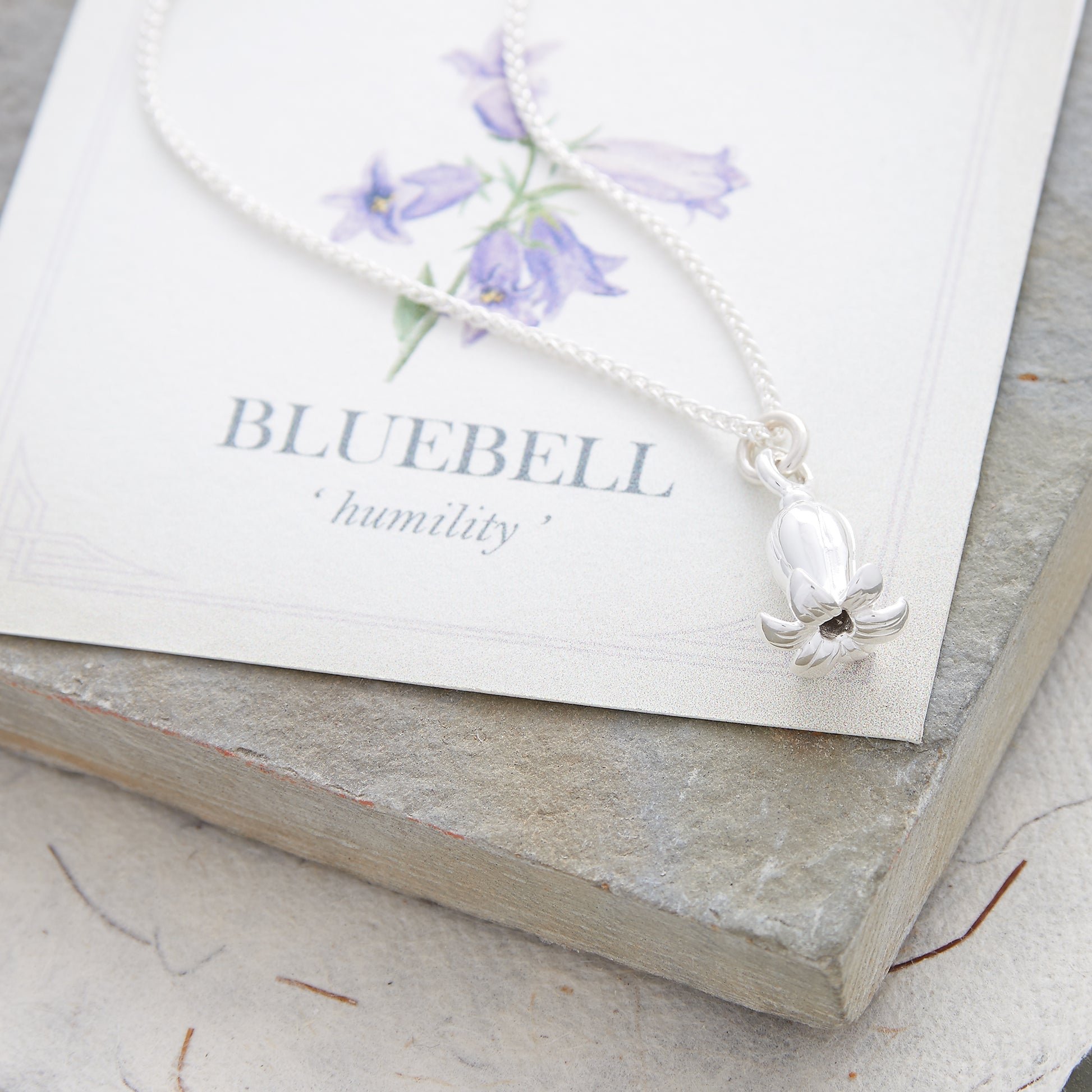 Silver bluebell charm on rope-style spiga chain necklace in gift box with meaning card