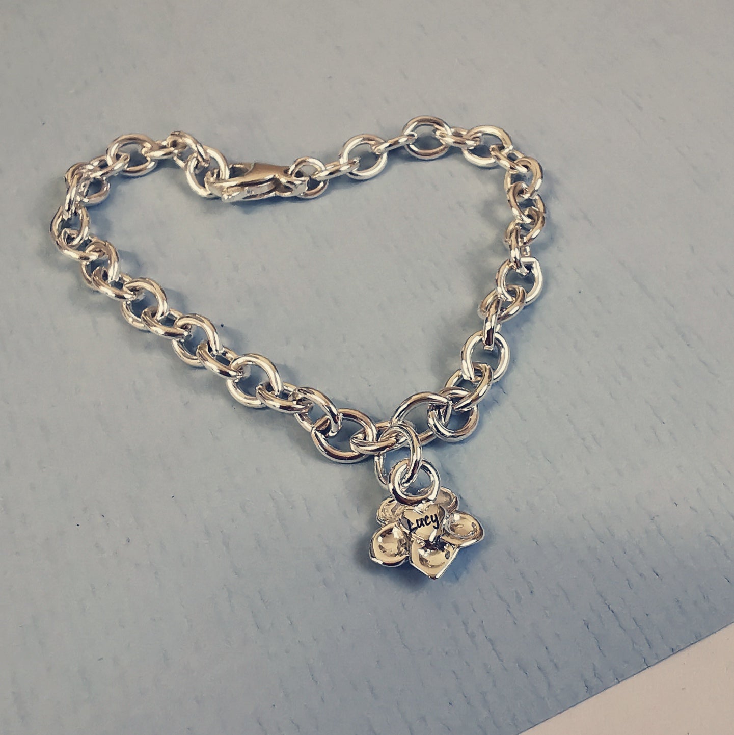 personalised engraved remembrance bracelet forget me not flower charm with name on back in heart