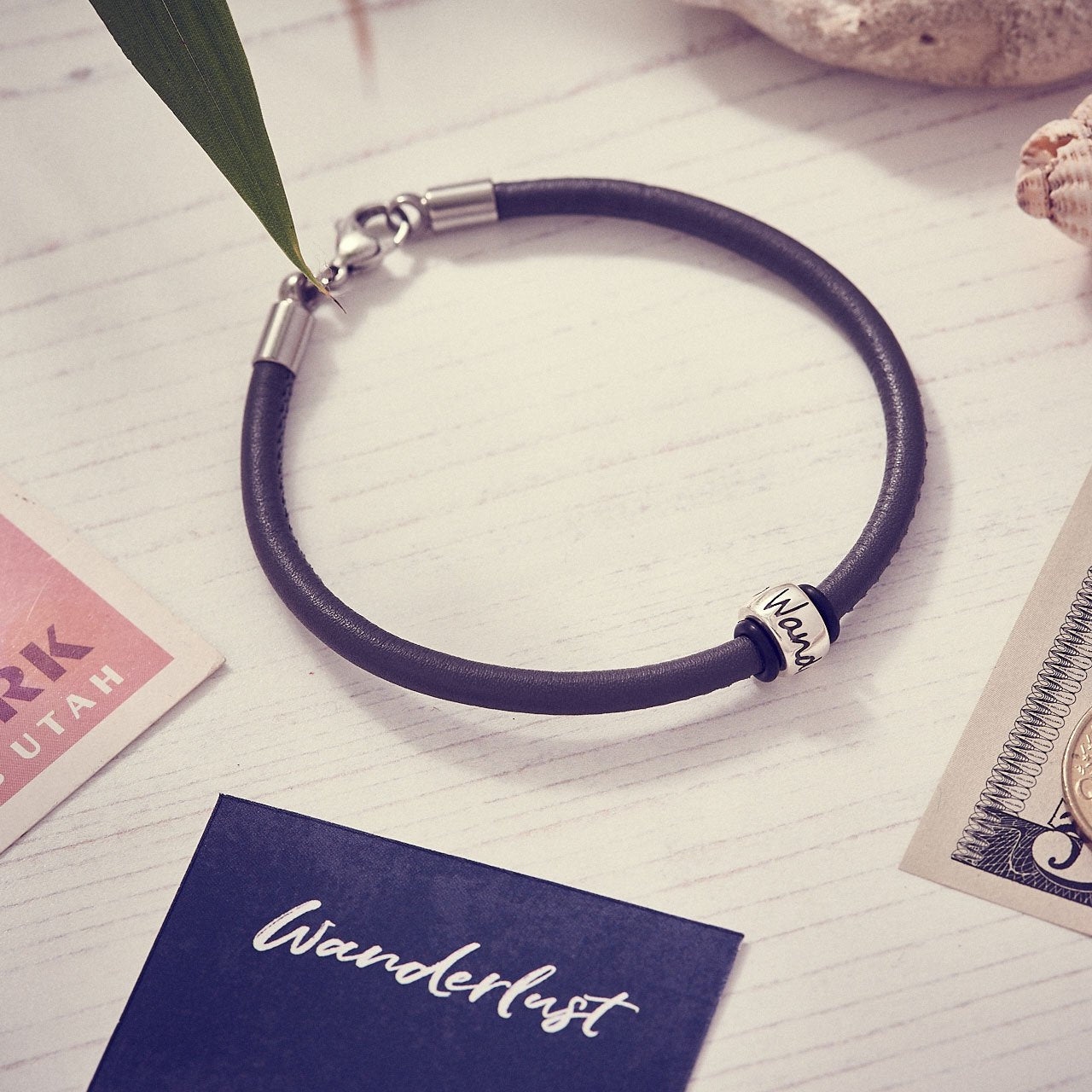 Black mens leather bracelet with silver wanderlust charm bead