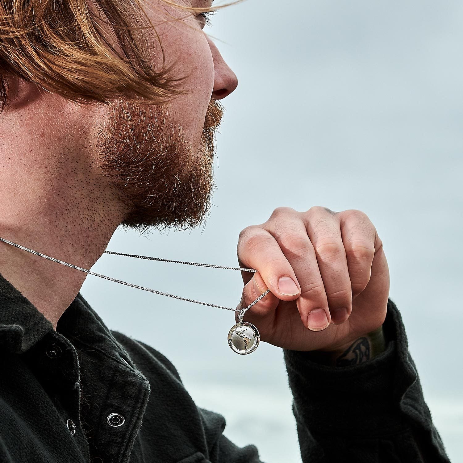 Silver globe necklace off the map alternative saint christopher