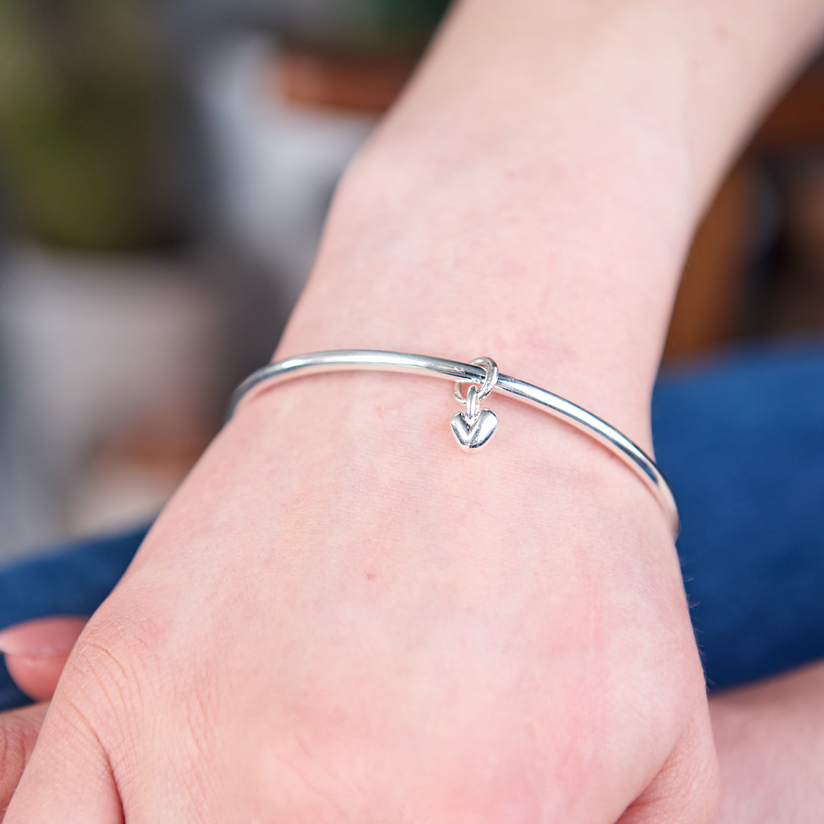 Recycled silver heart charm bangle made in UK by Scarlett Jewellery