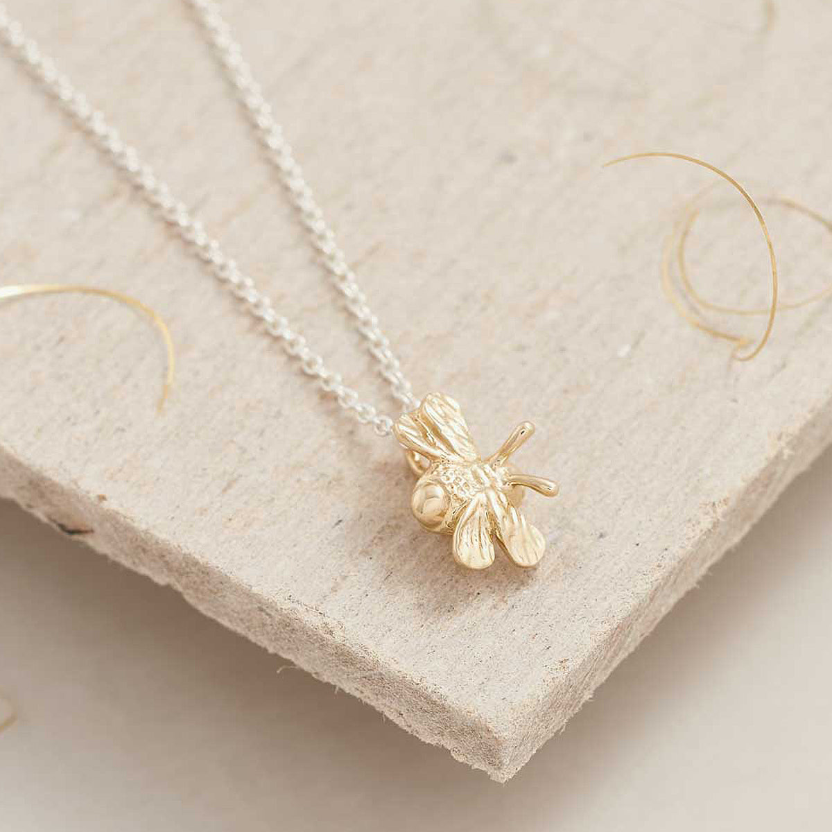 Tiny solid gold bumble bee charm scarlett jewellery