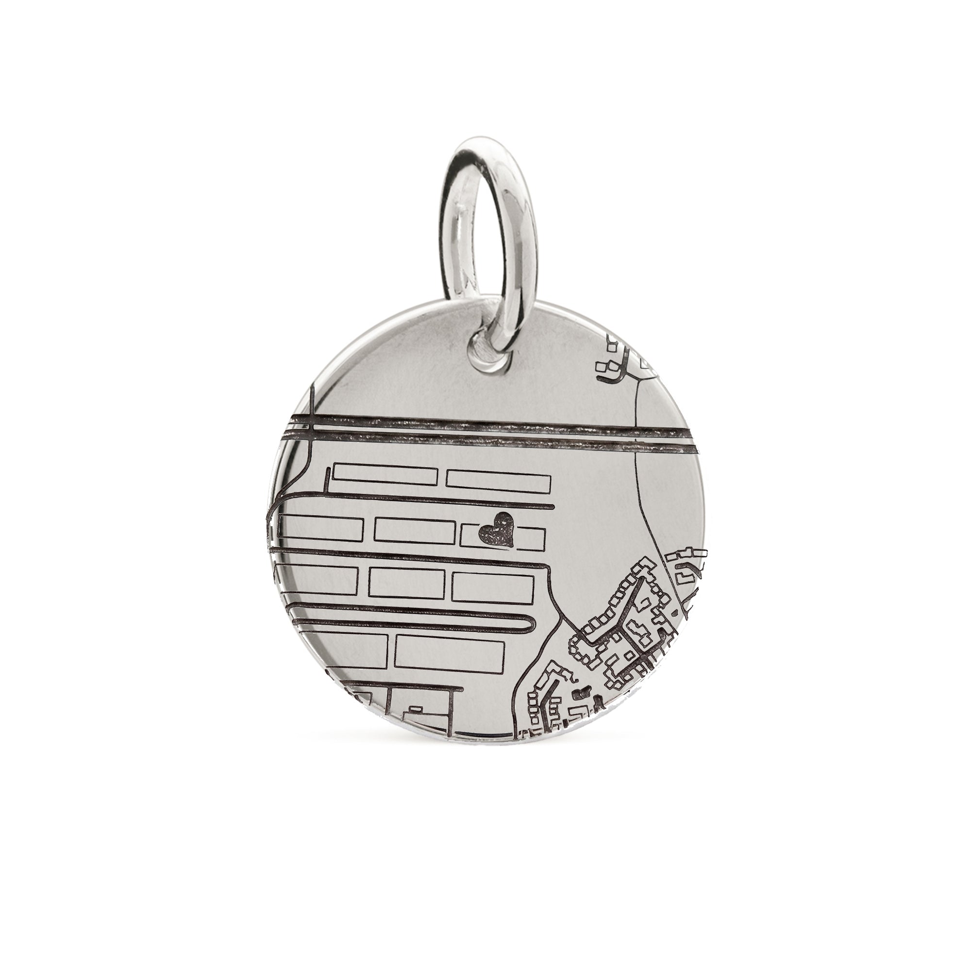 Silver pendant with map design on a white background