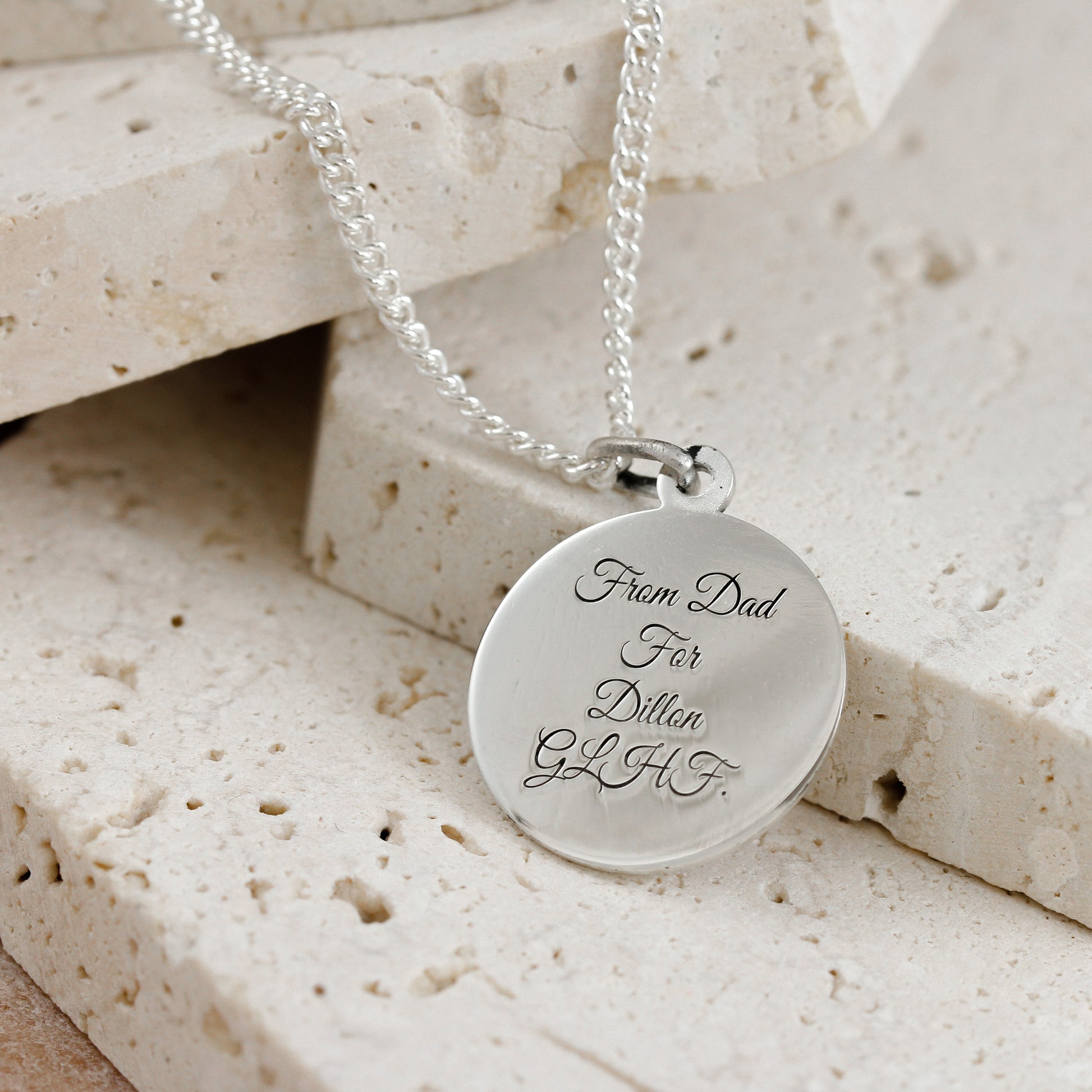 great vibes script font engraving on saint christopher