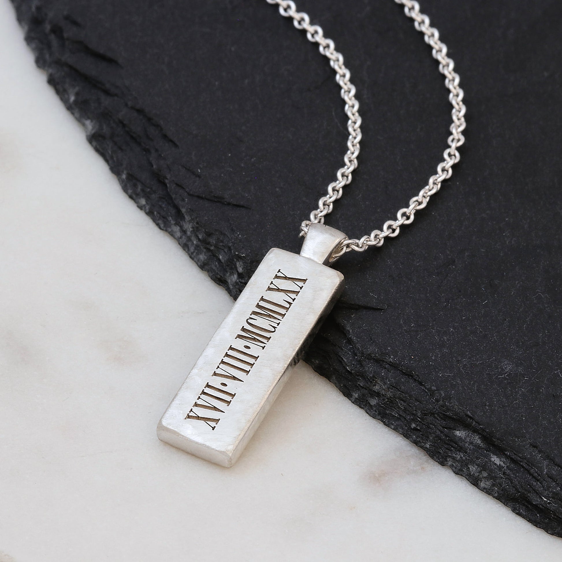 engraved roman numerals ingot style pendant on trace chain