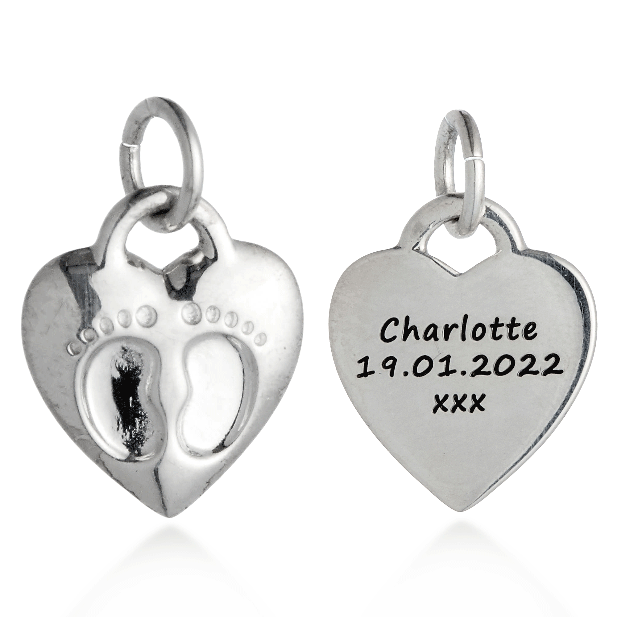 Two silver heart-shaped pendants with one featuring a baby footprint design and the other engraved with text.