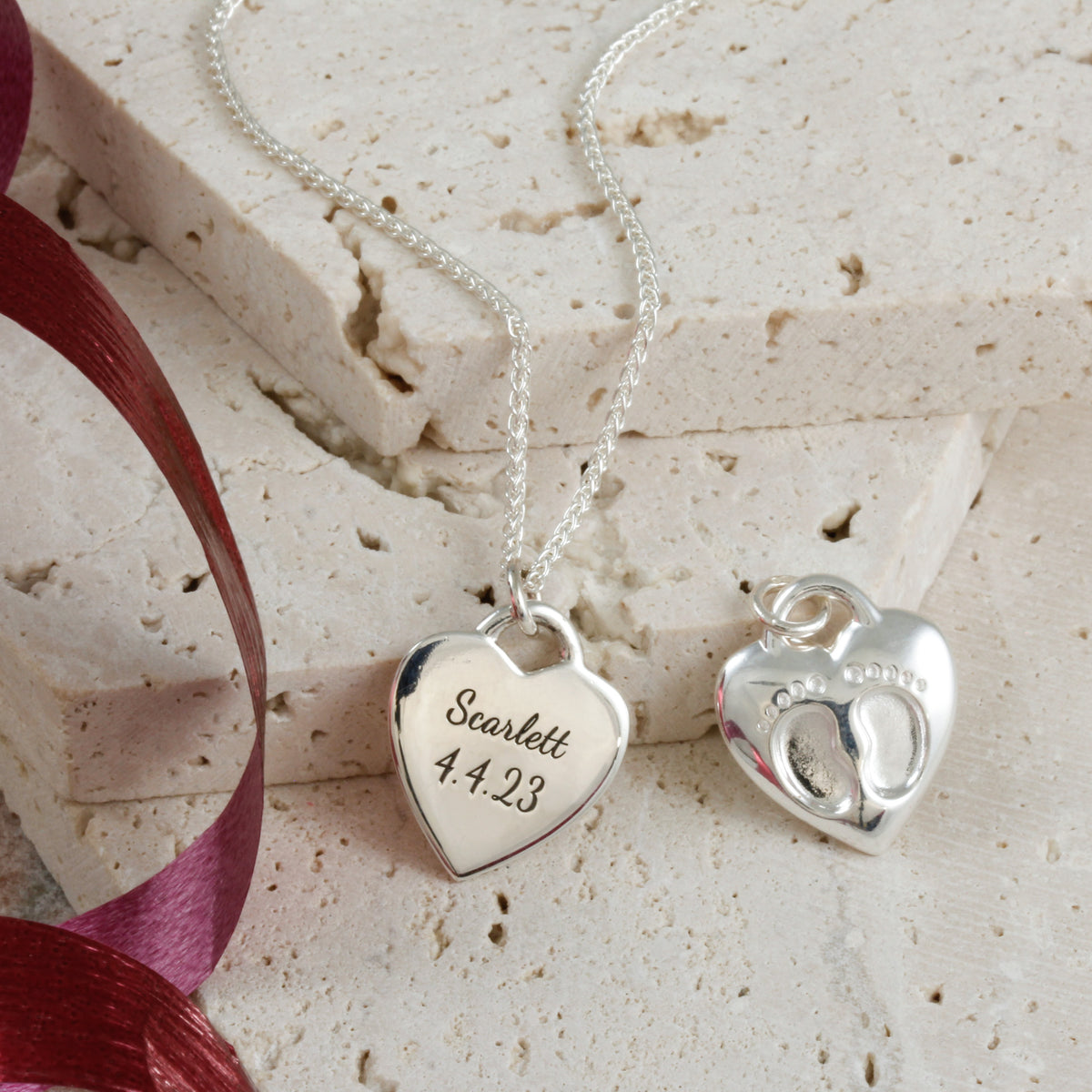 baby footsteps necklace engraved with birth date
