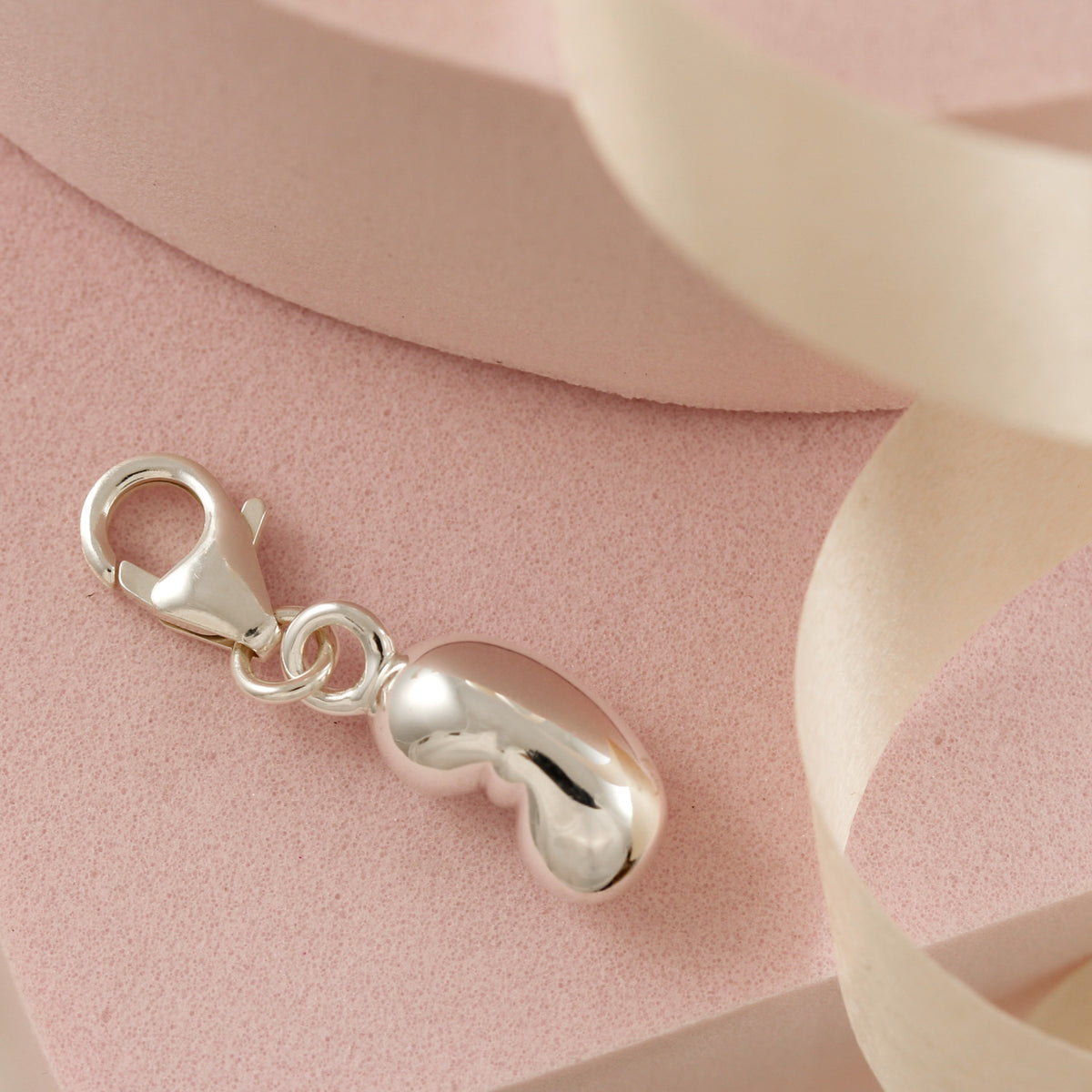 silver baby bean charm with clip on clasp