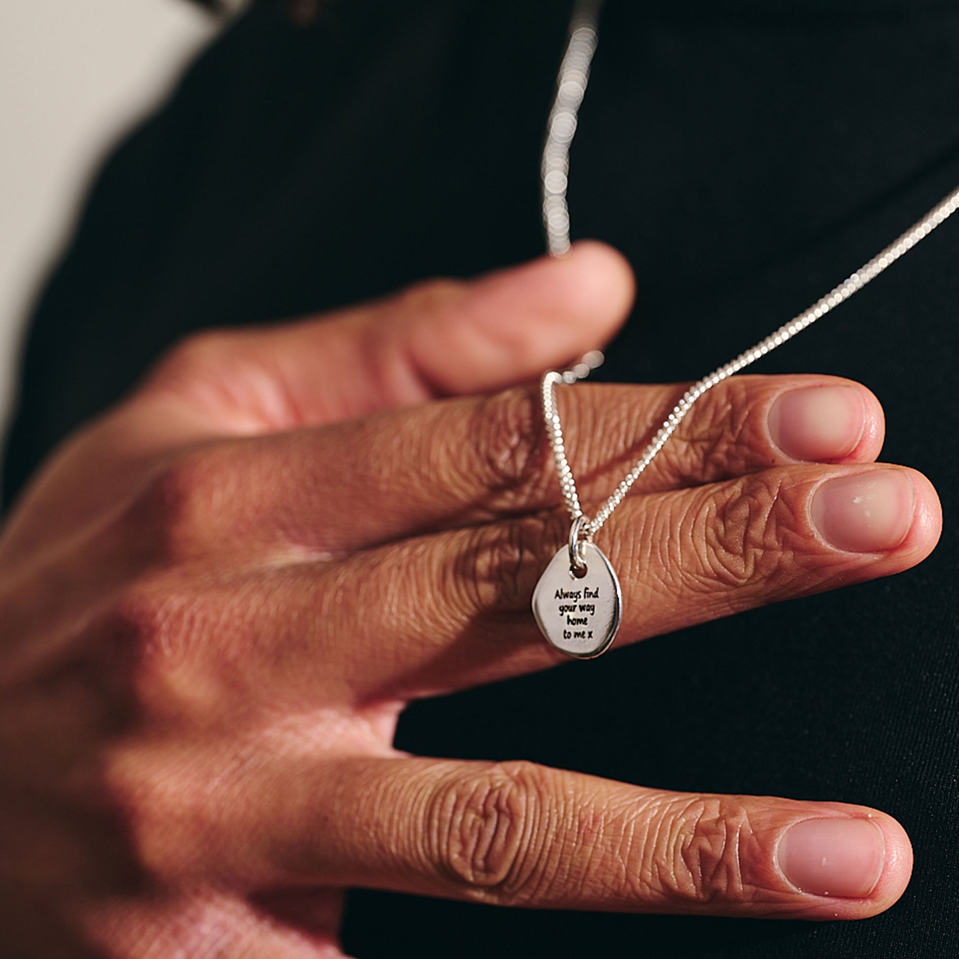 engraved back of rune necklace