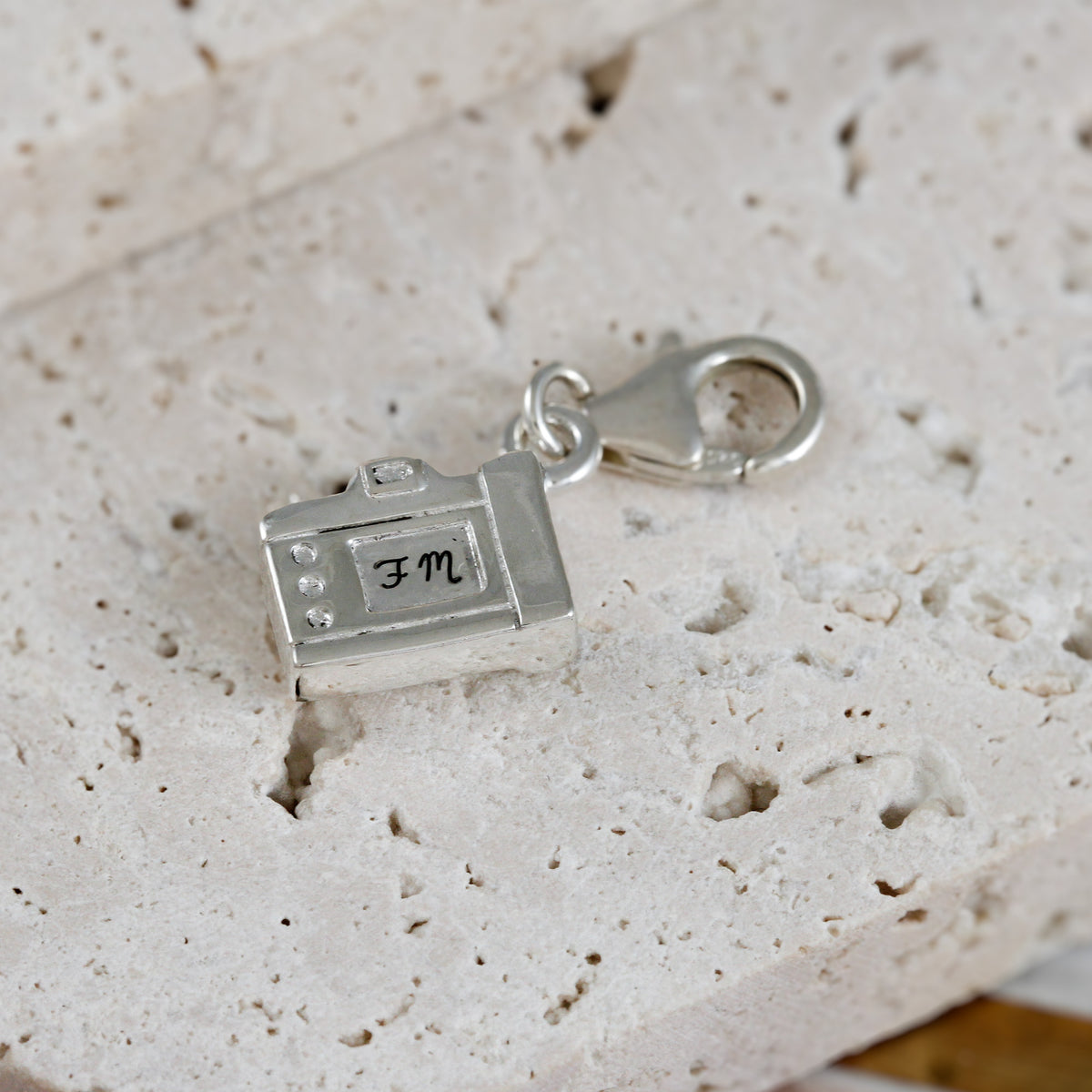 camera charm with clip on clasp engraved on the back with initials
