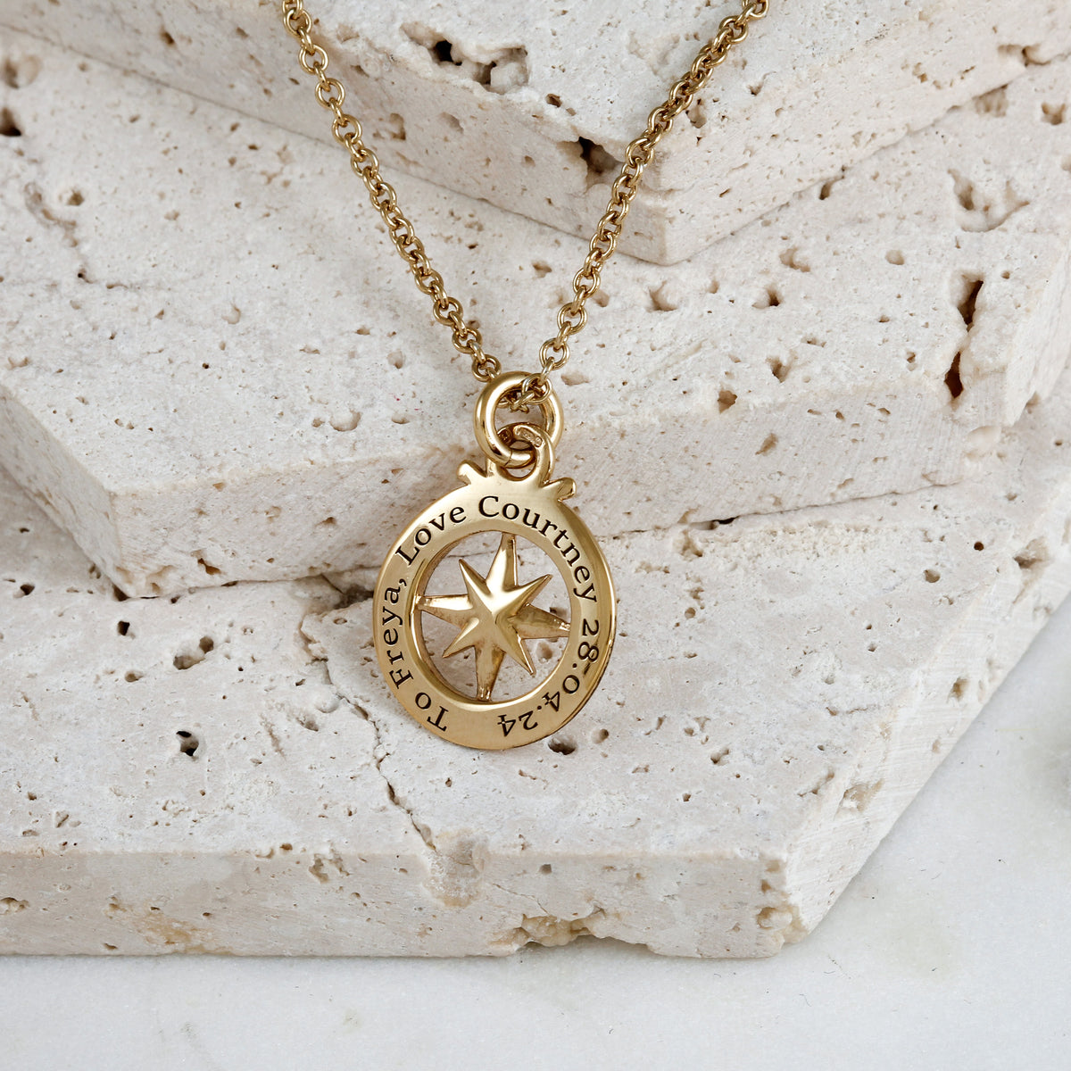 small solid gold compass necklace on trace chain engraved back