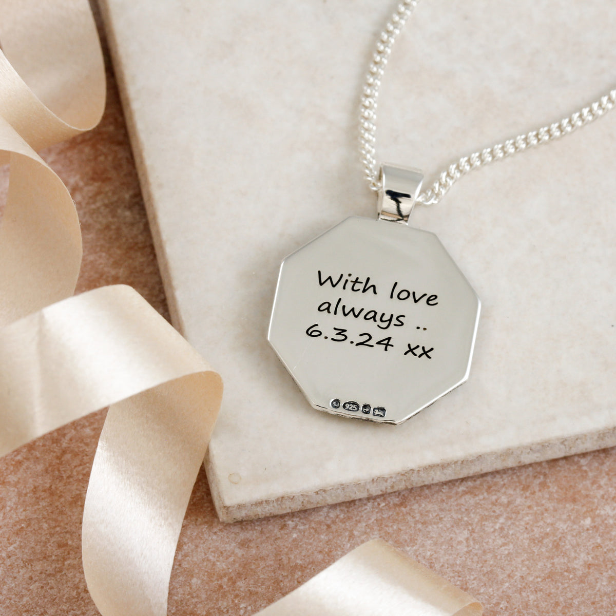 with love always engraved back of lucky pendant