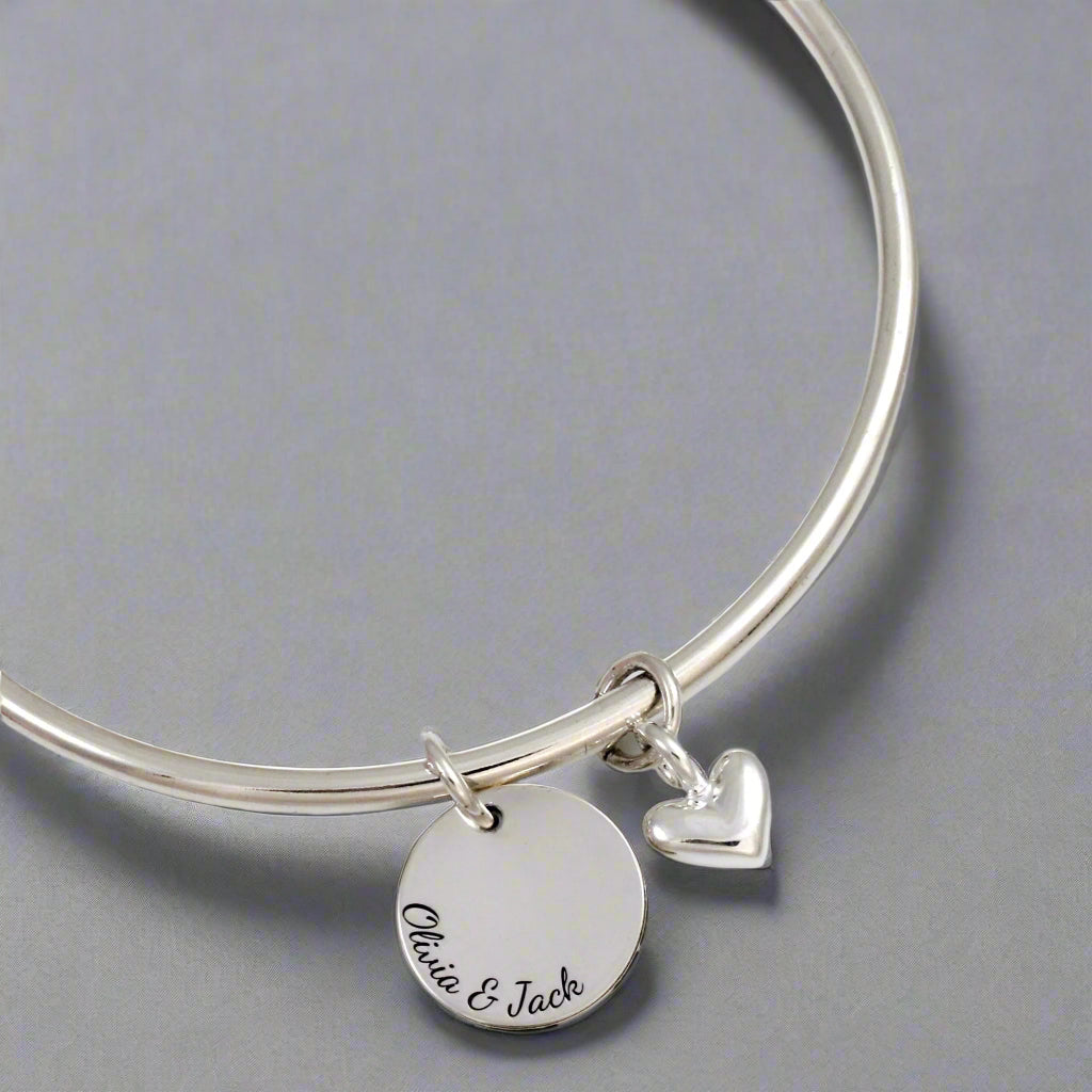 silver bangle with heart and personalised disc charm