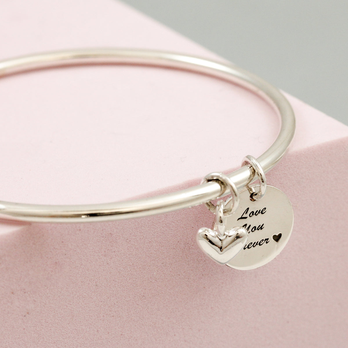 silver bangle with heart and personalised disc charm