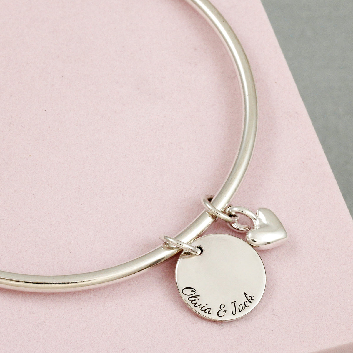 silver bangle with heart and personalised disc charm