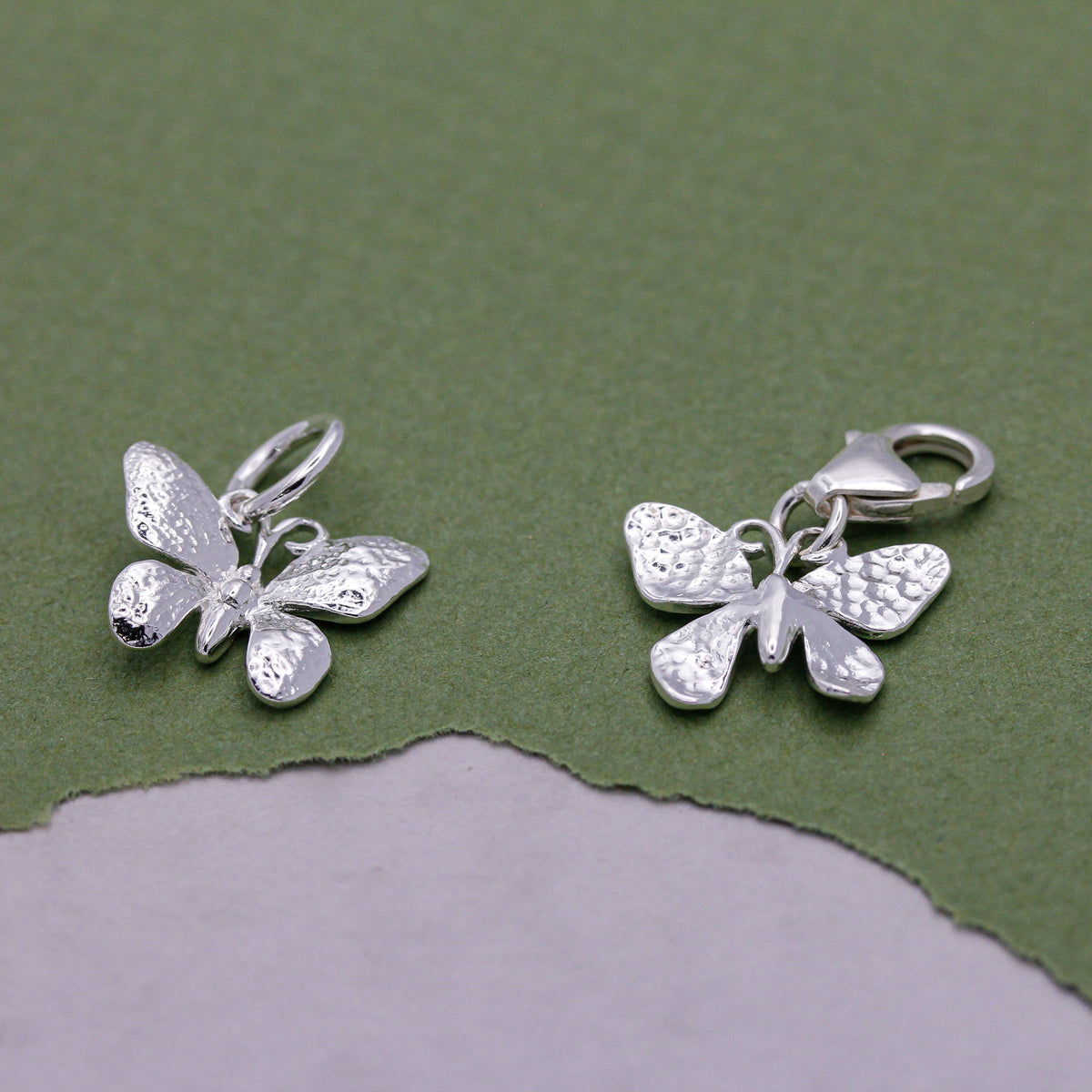 Sterling silver butterfly charm with detailed wings, symbol of transformation and renewal