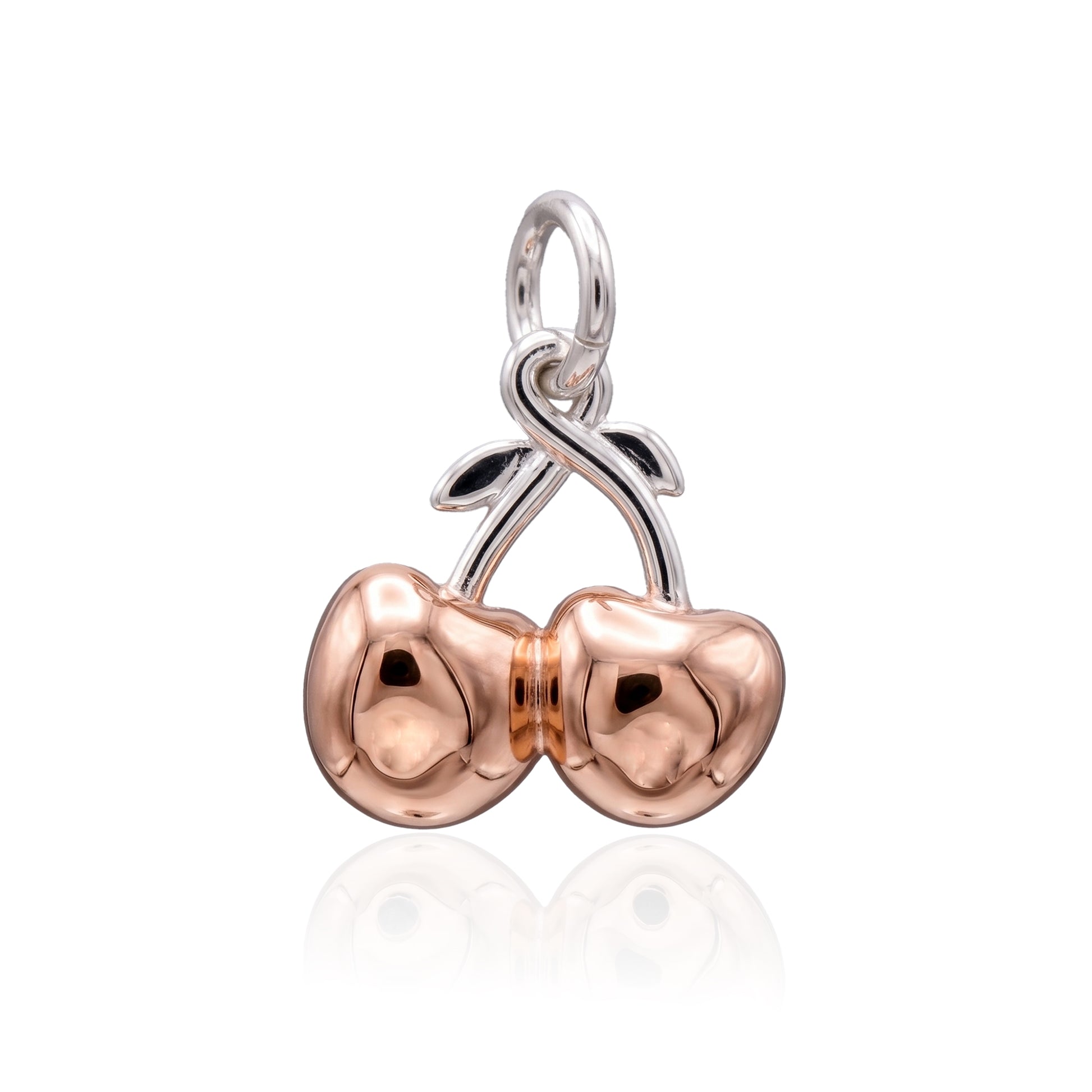 Rose gold and silver cherry pendant on a white background