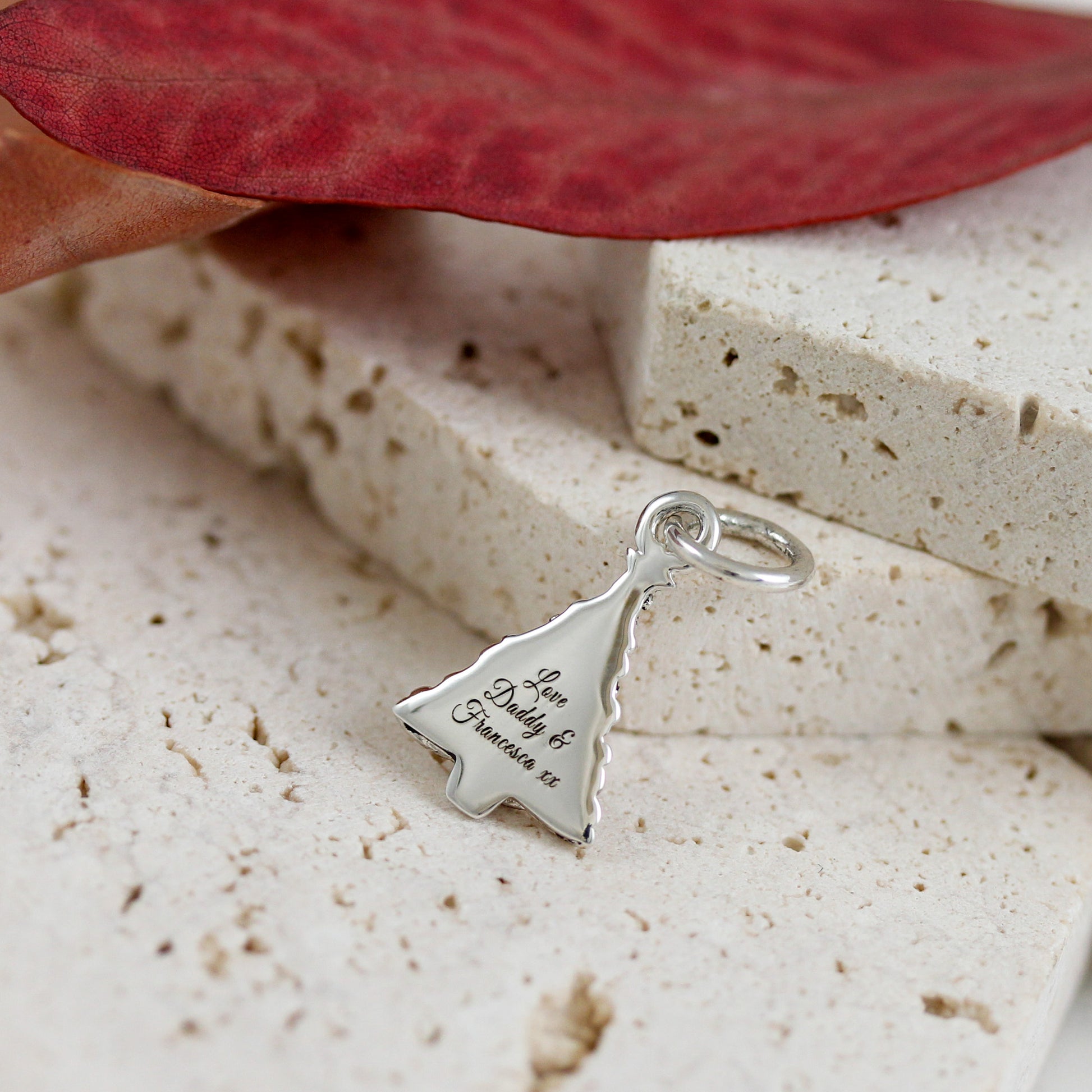 christmas tree charm engraved on the back