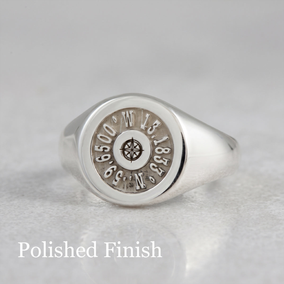 latitude longitude coordinates engraved silver signet ring with polished finish and compass rose