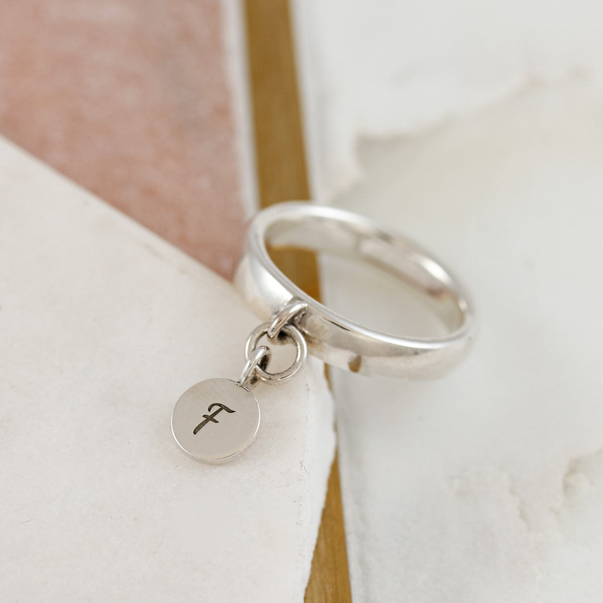 silver disc charm ring engraved with F