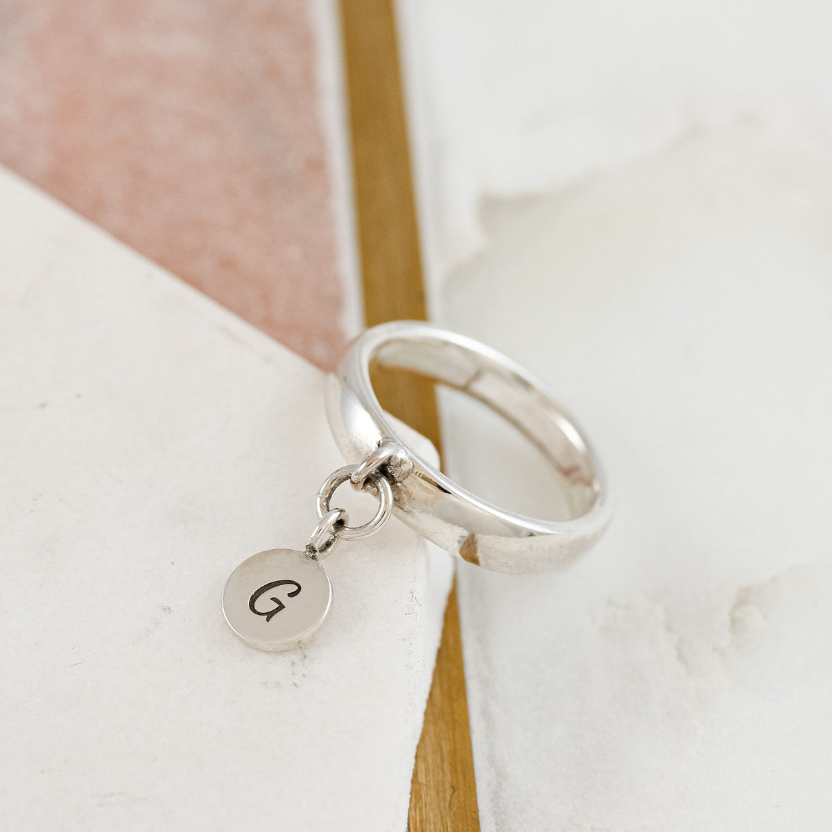 silver disc charm ring engraved with G