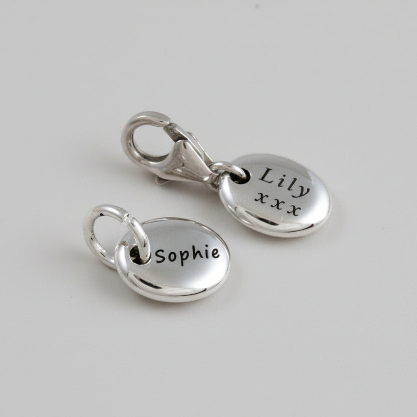 silver engraved pebble charm with open and clip on clasps