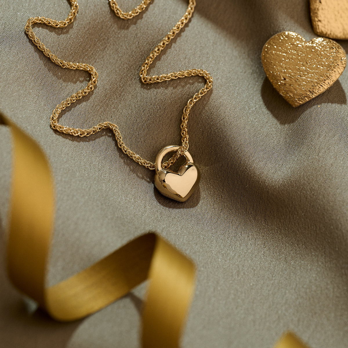 large solid gold heart pendant on thick gold spiga chain