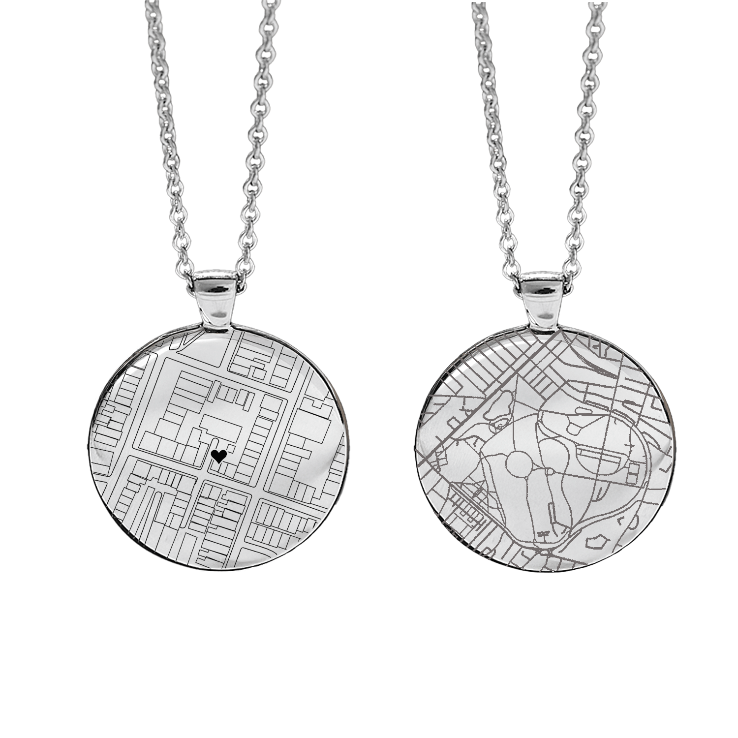 Two silver necklaces with circular pendants with custom street map designs