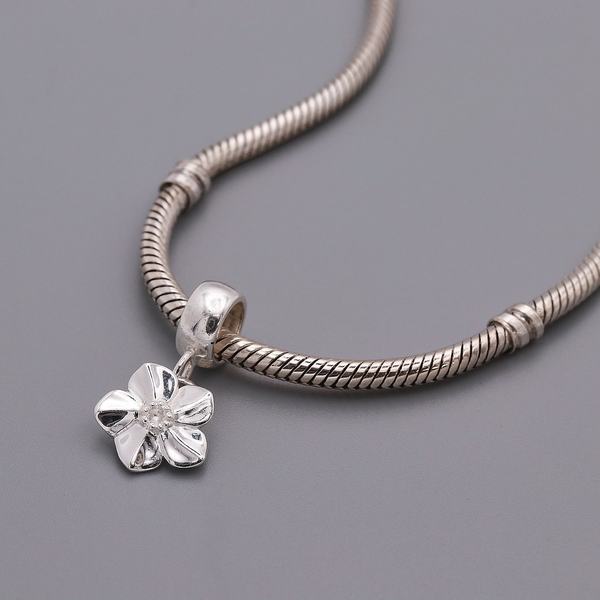 Forget me not charm on bead style bracelet