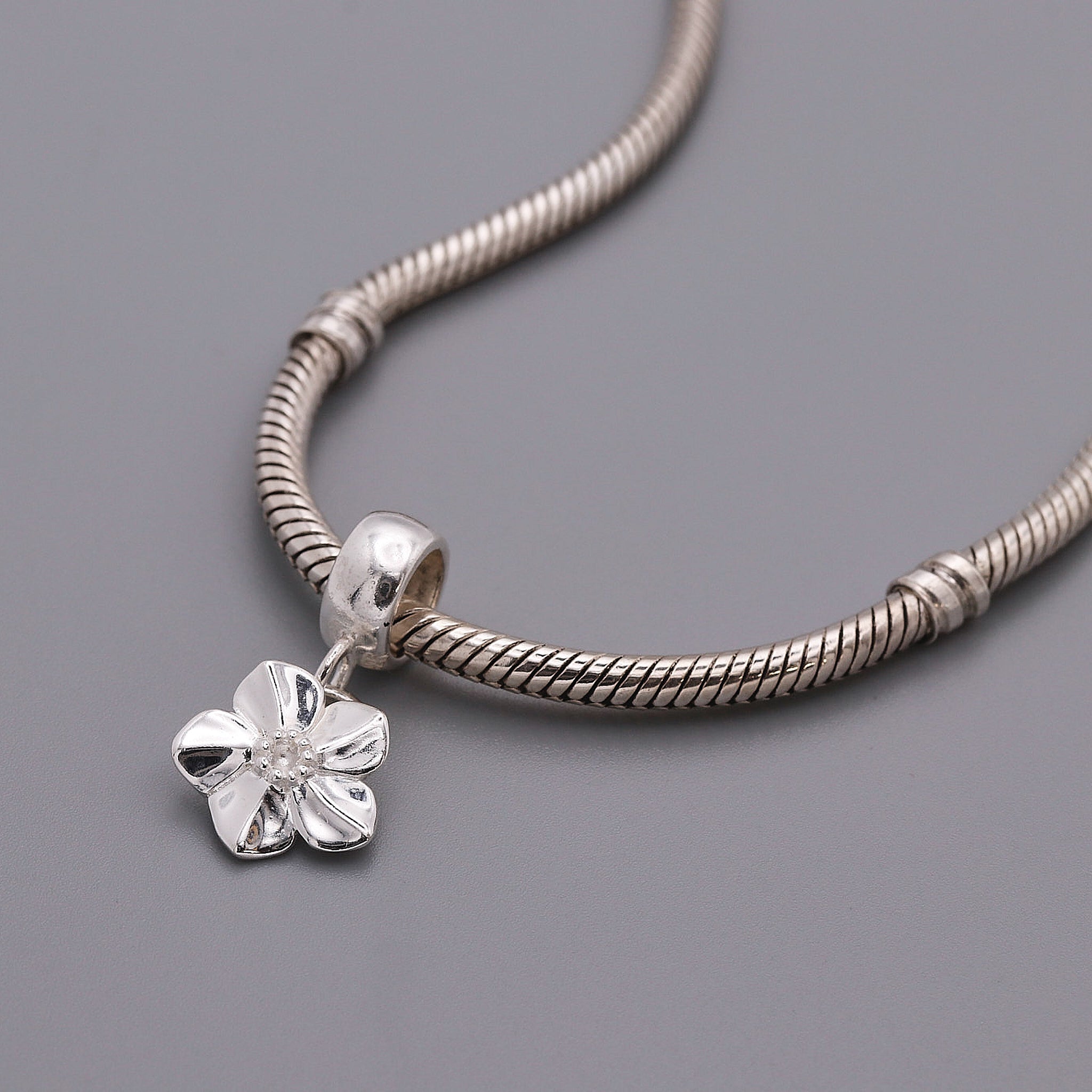 Forget me not charm on bead style bracelet