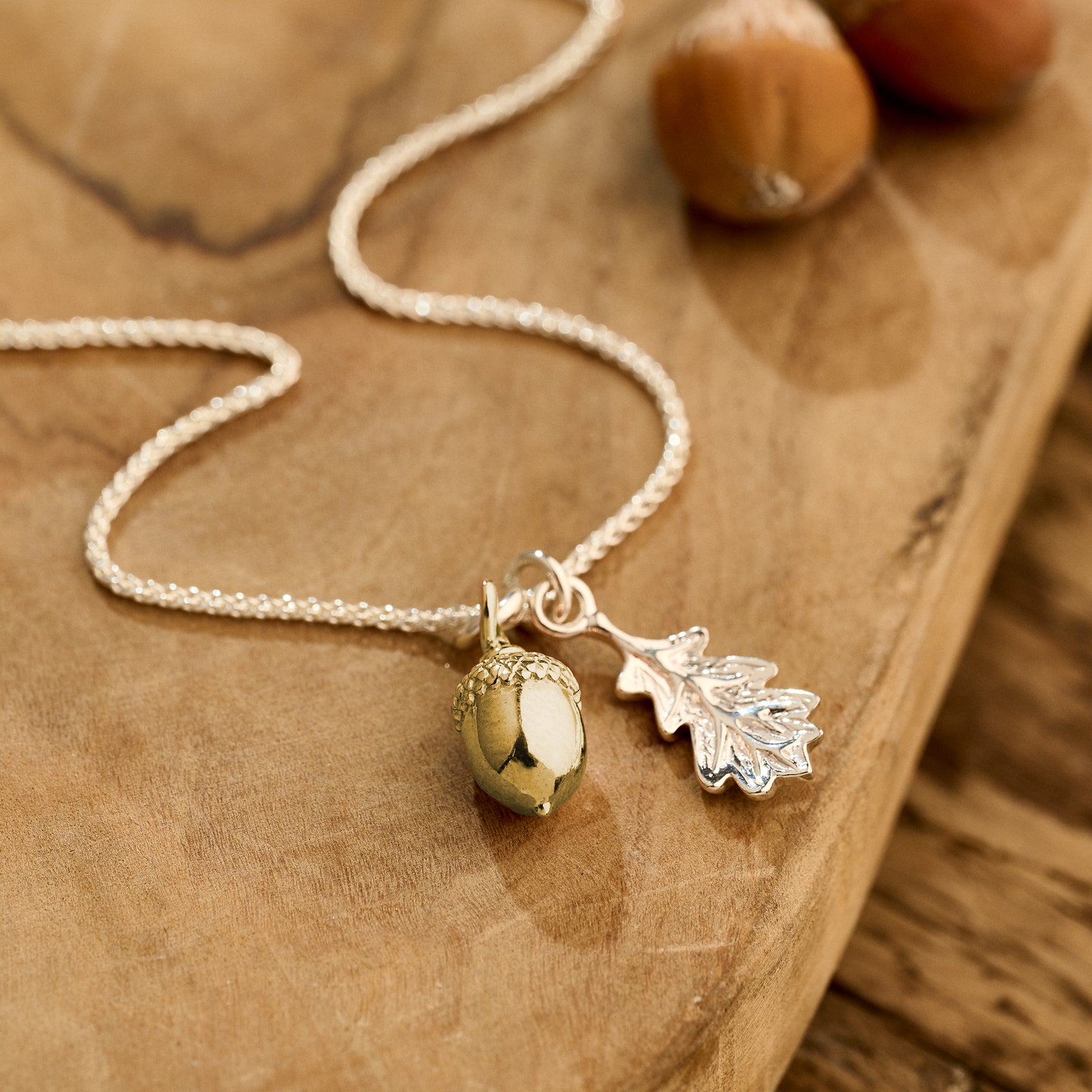 solid gold acorn and silver oak leaf necklace