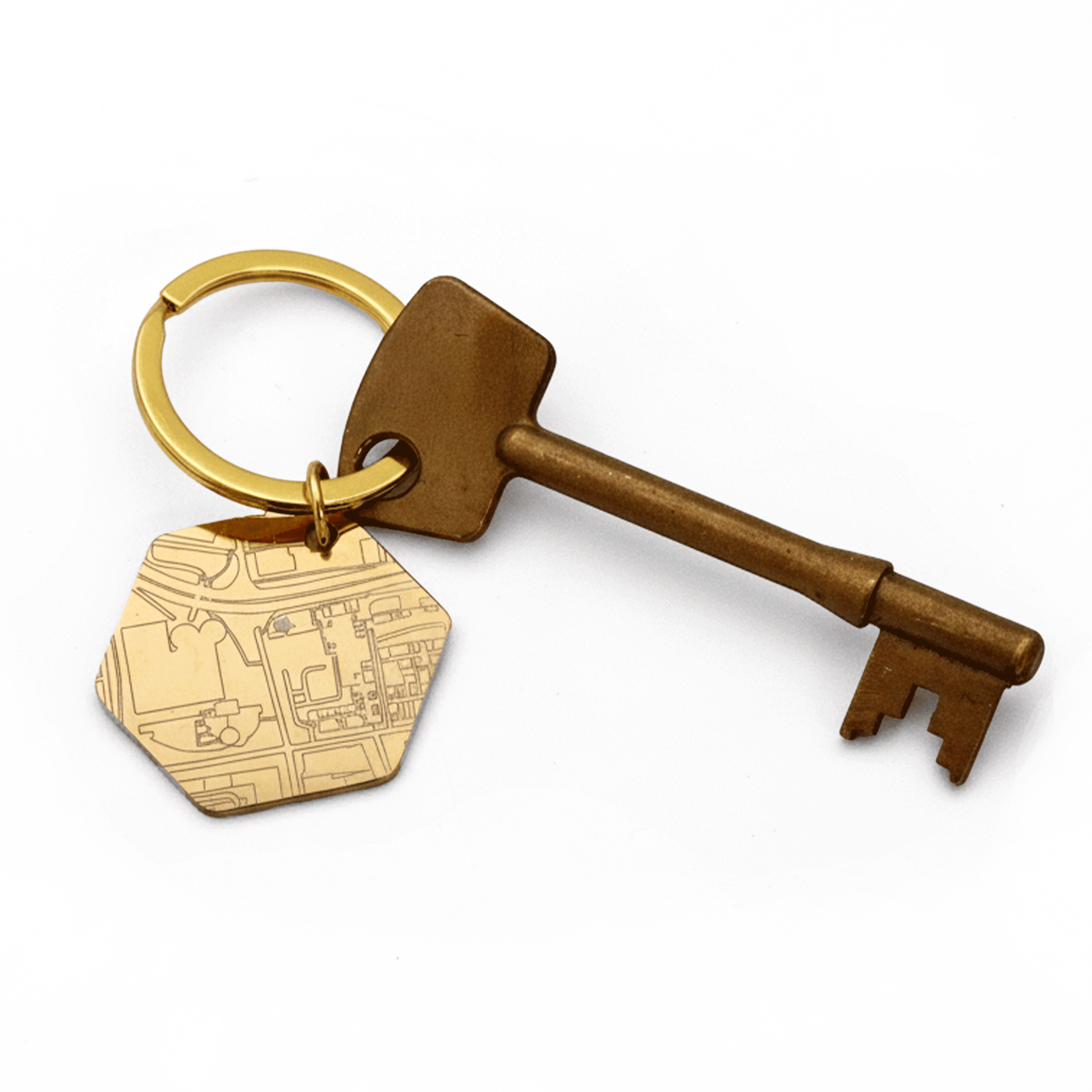 Bronze key and gold street map tag keychain on a white background