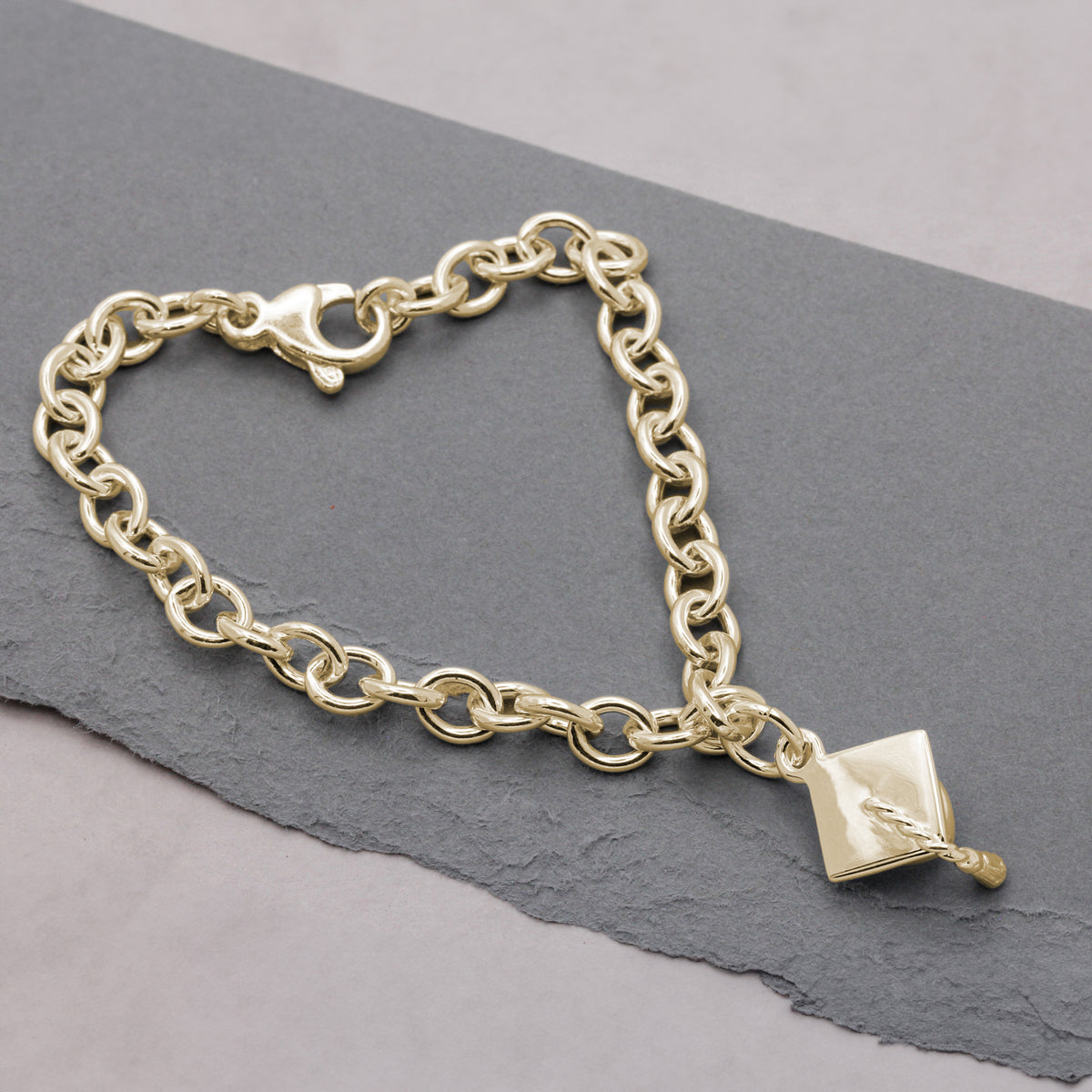 gold plated mortar board charm bracelet.jpg