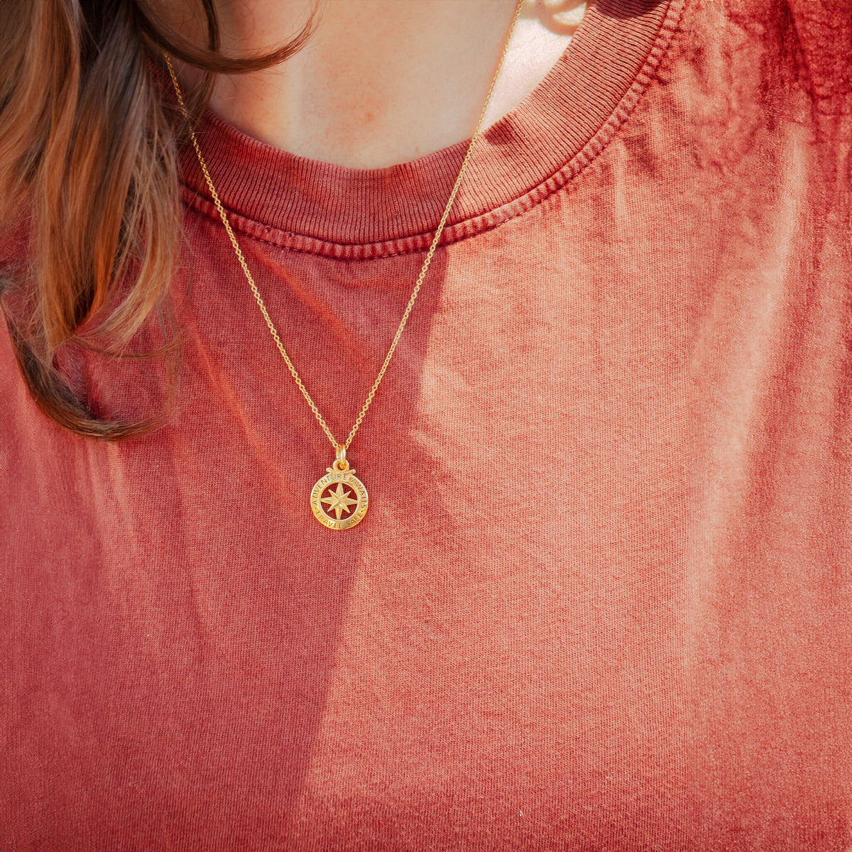 gold plated outline compass necklace on trace chain