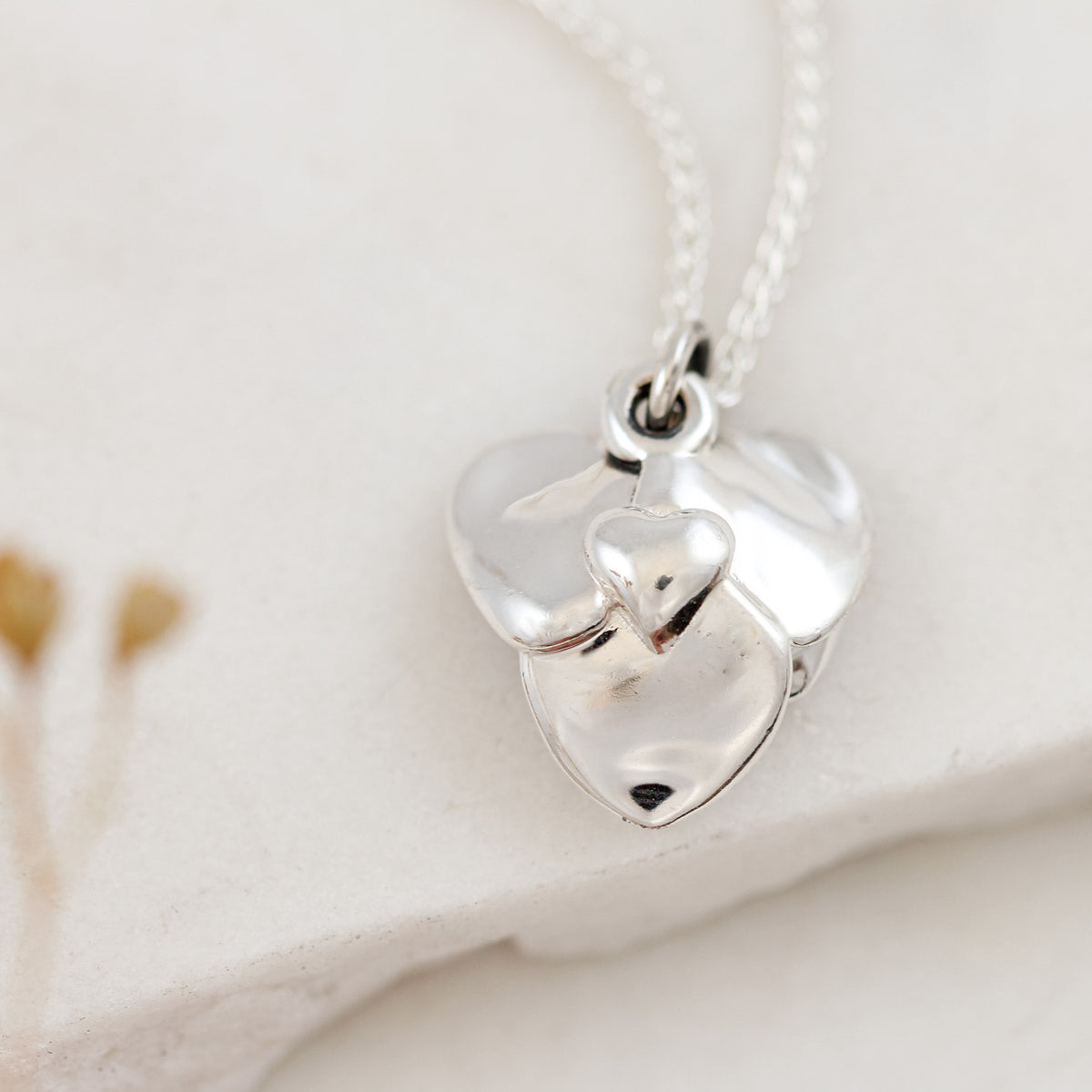 back of heart shaped rose necklace with heart detail