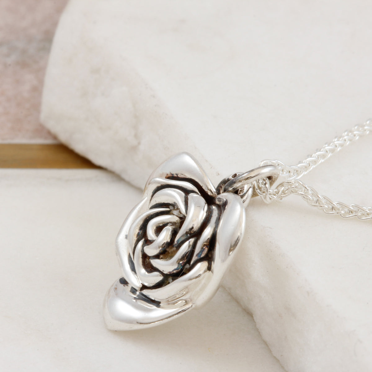 side view of heart shaped rose necklace