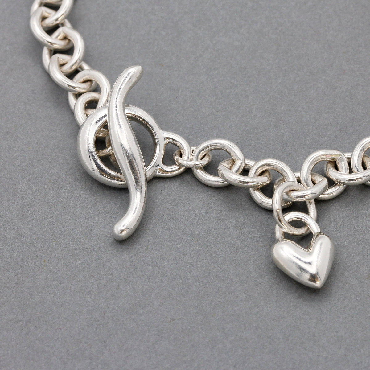 chunky silver charm bracelet with traditional T-bar