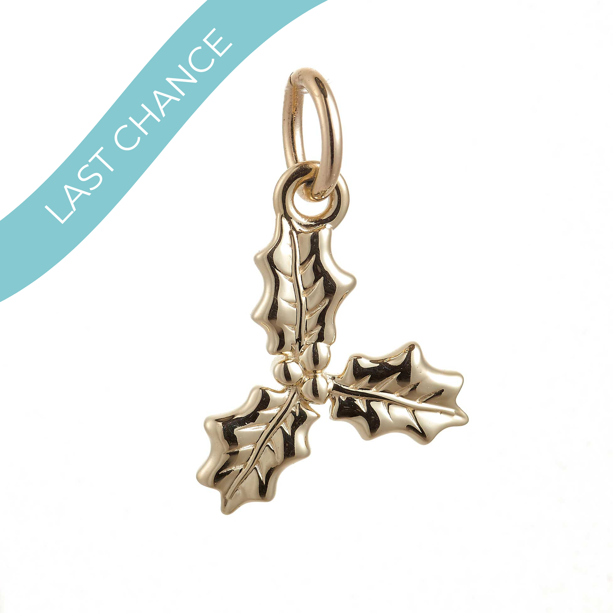 A gold holly leaf charm pendant with three leaves and a top loop, shown on a white background with a light blue diagonal banner reading 'LAST CHANCE'.