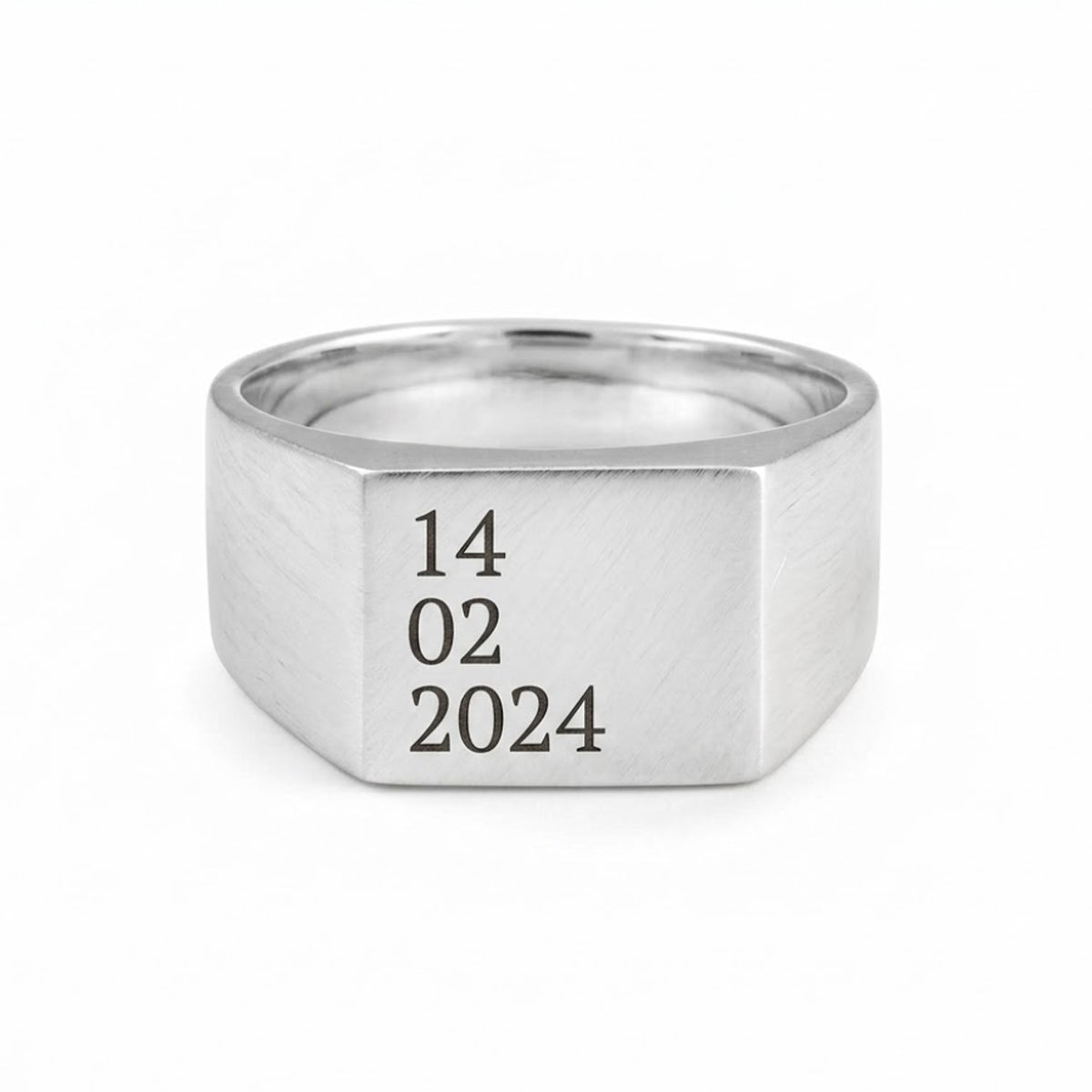 signet ring with date engraved on a white background