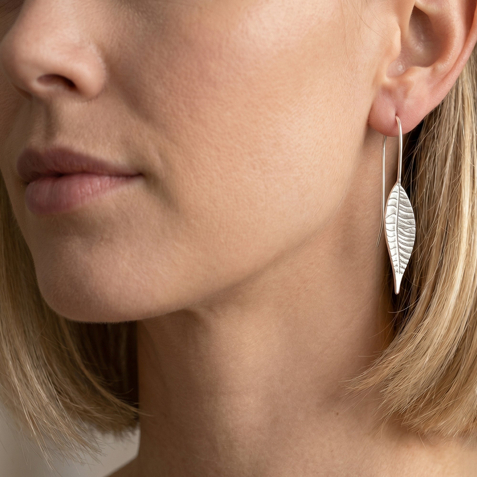 Long leaf silver drop earrings